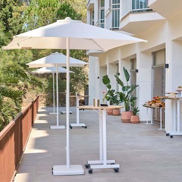 a patio with umbrellas and tables