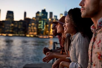a group of people looking at a city