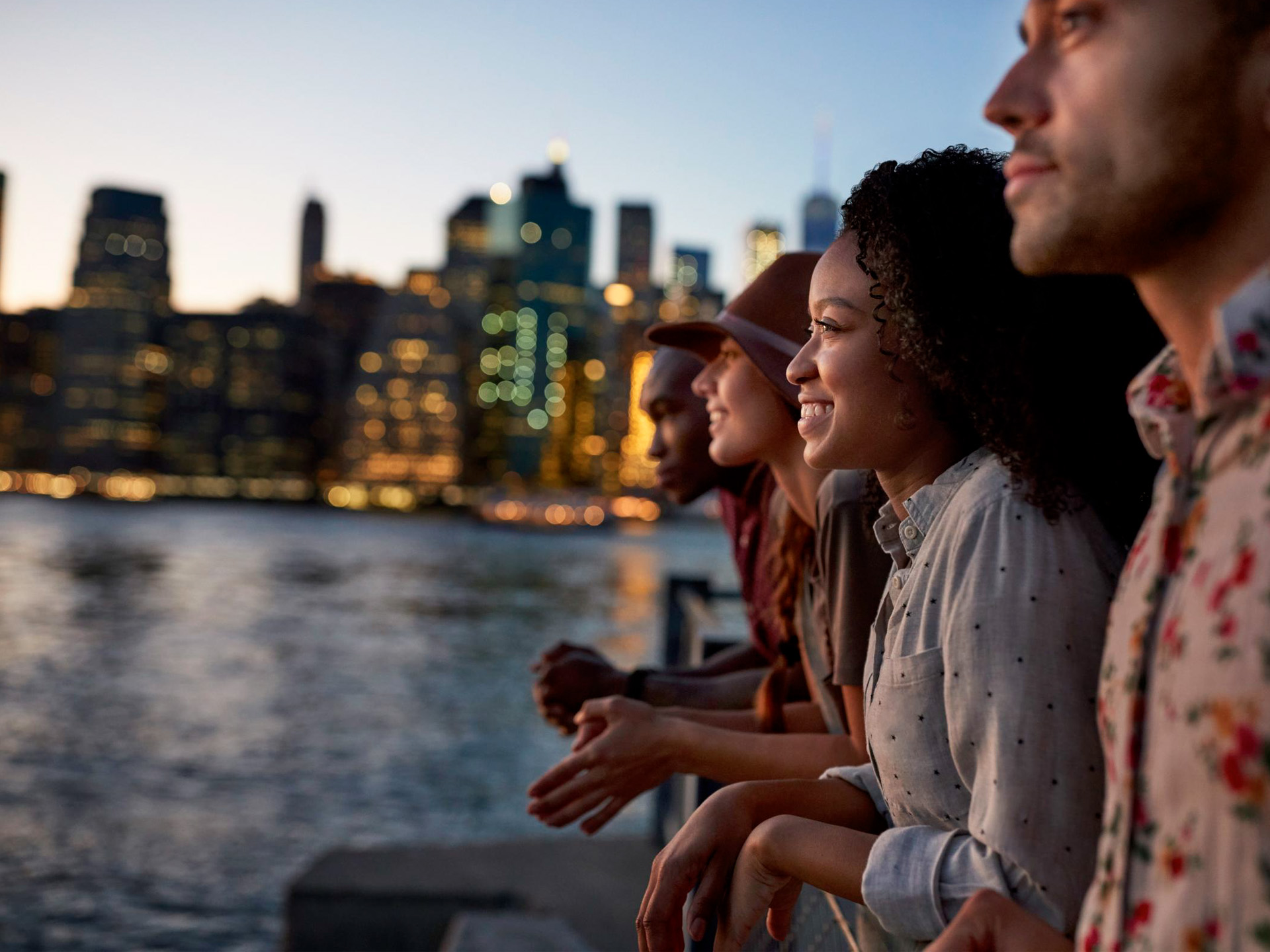 a group of people looking at a city