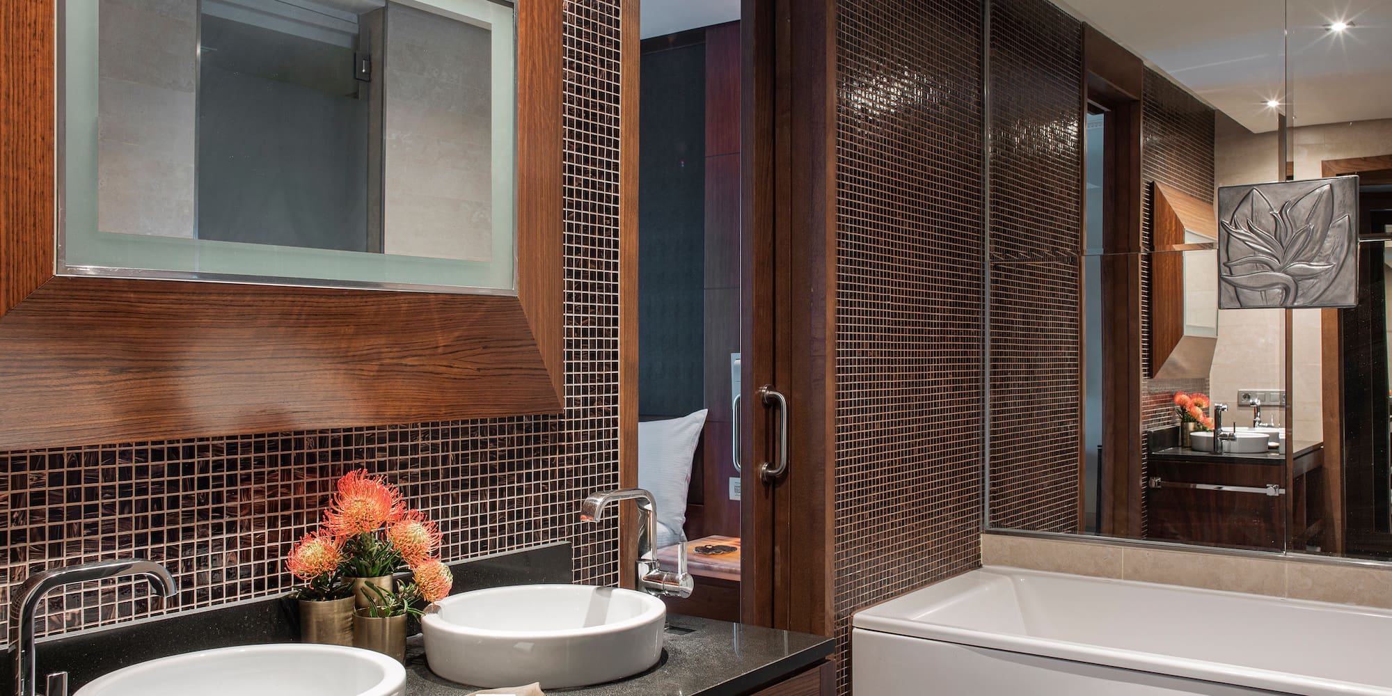 a bathroom with a mirror and sink