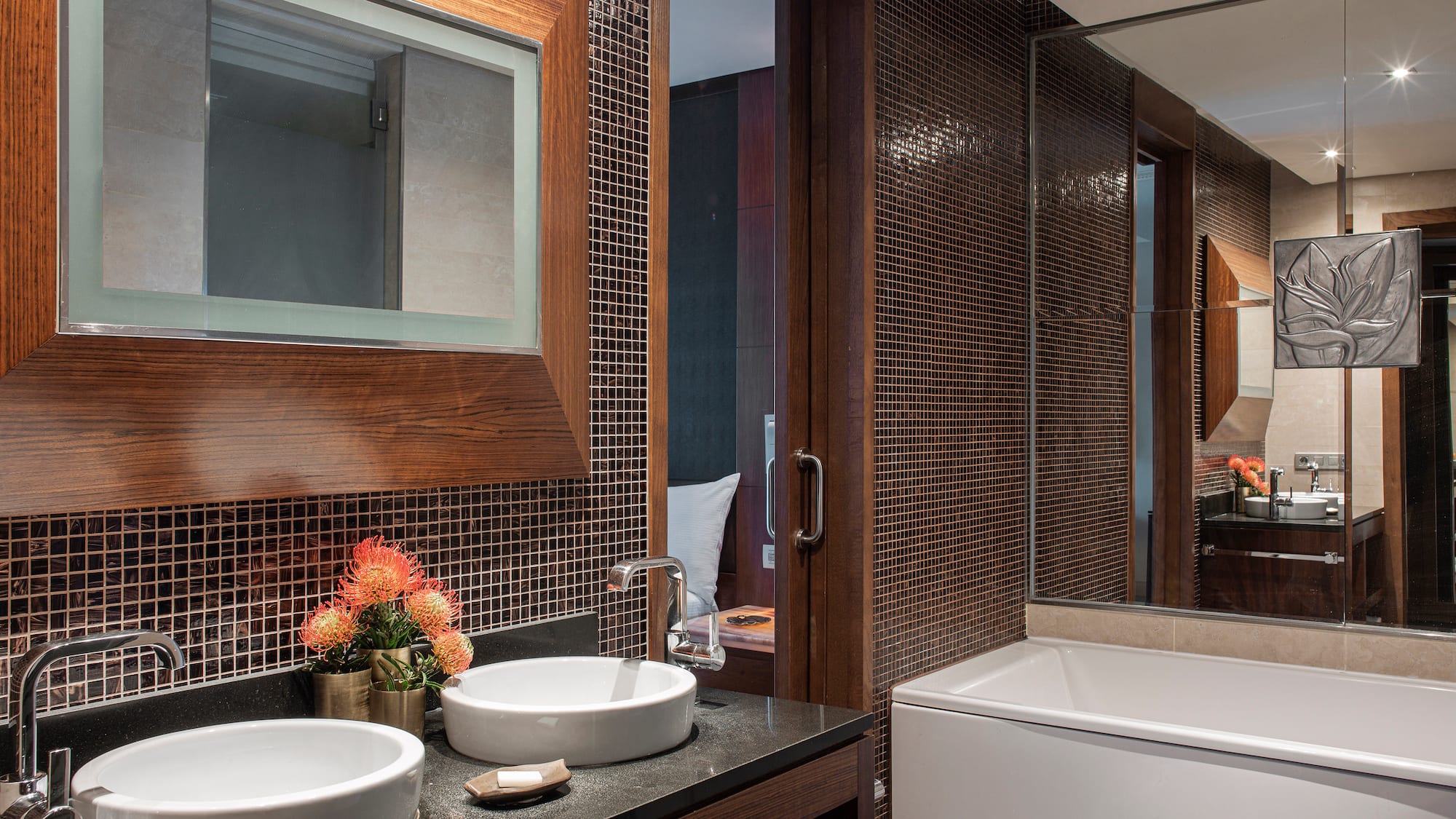 a bathroom with a mirror and sink