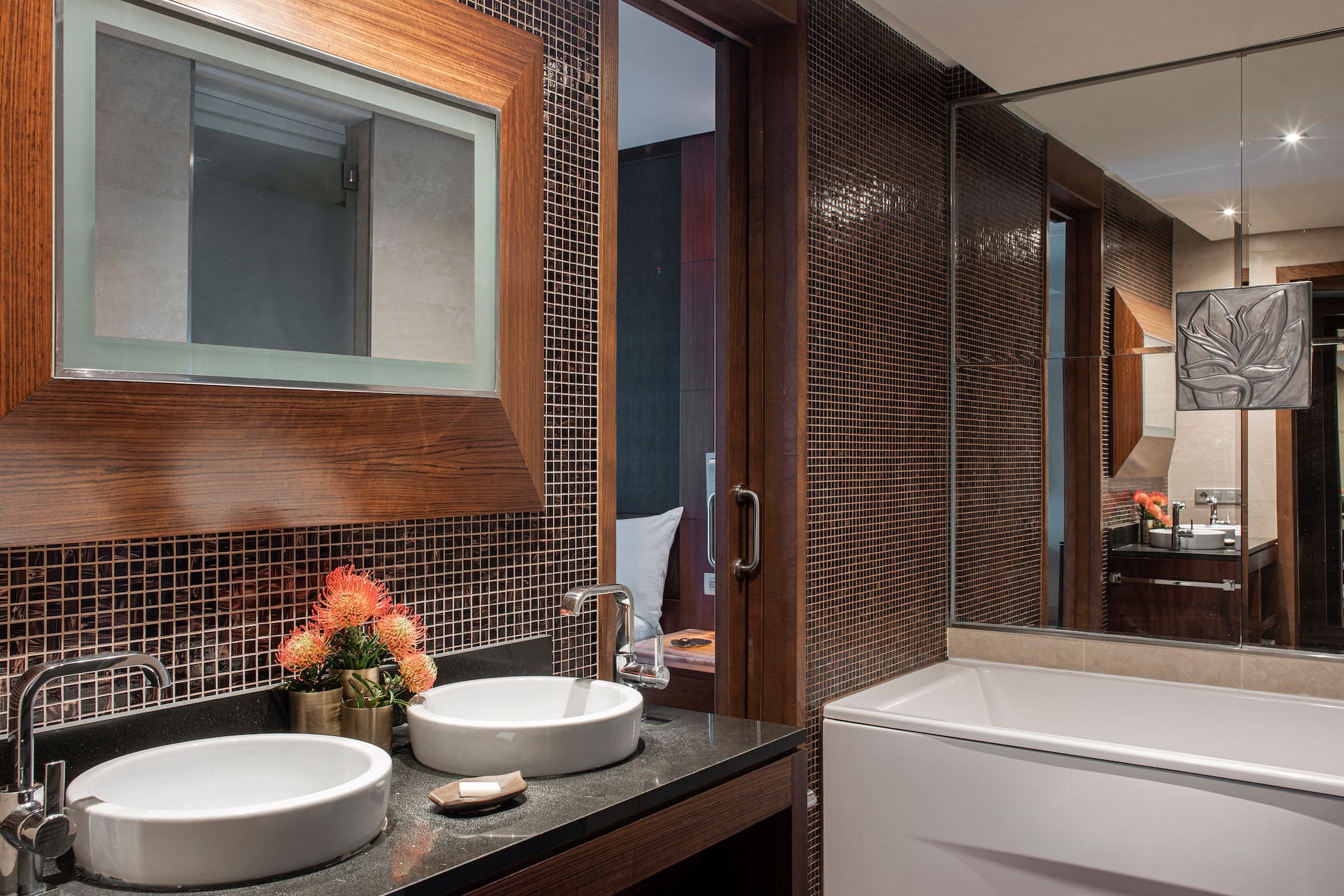 a bathroom with a mirror and sink