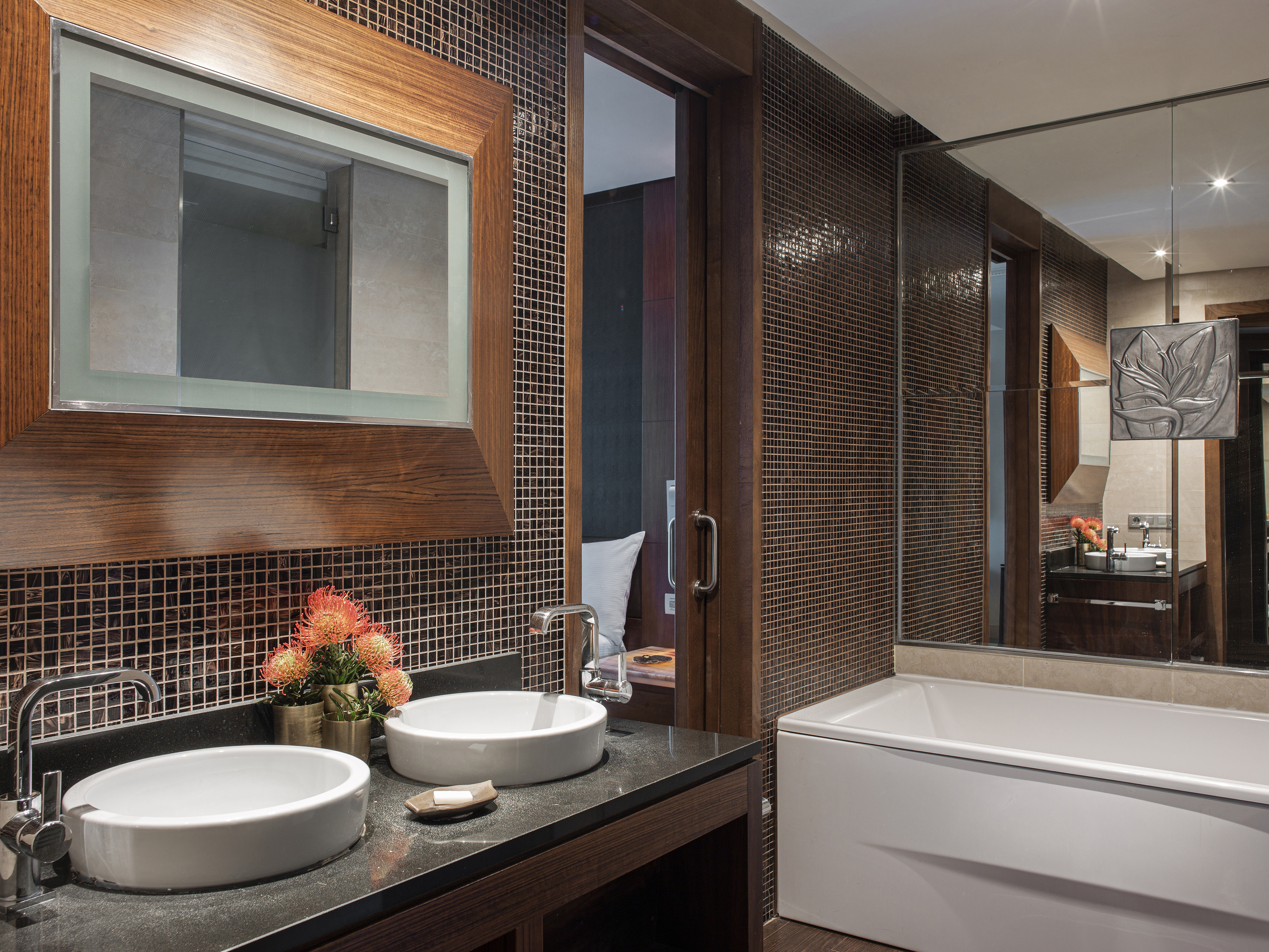 a bathroom with a mirror and sink