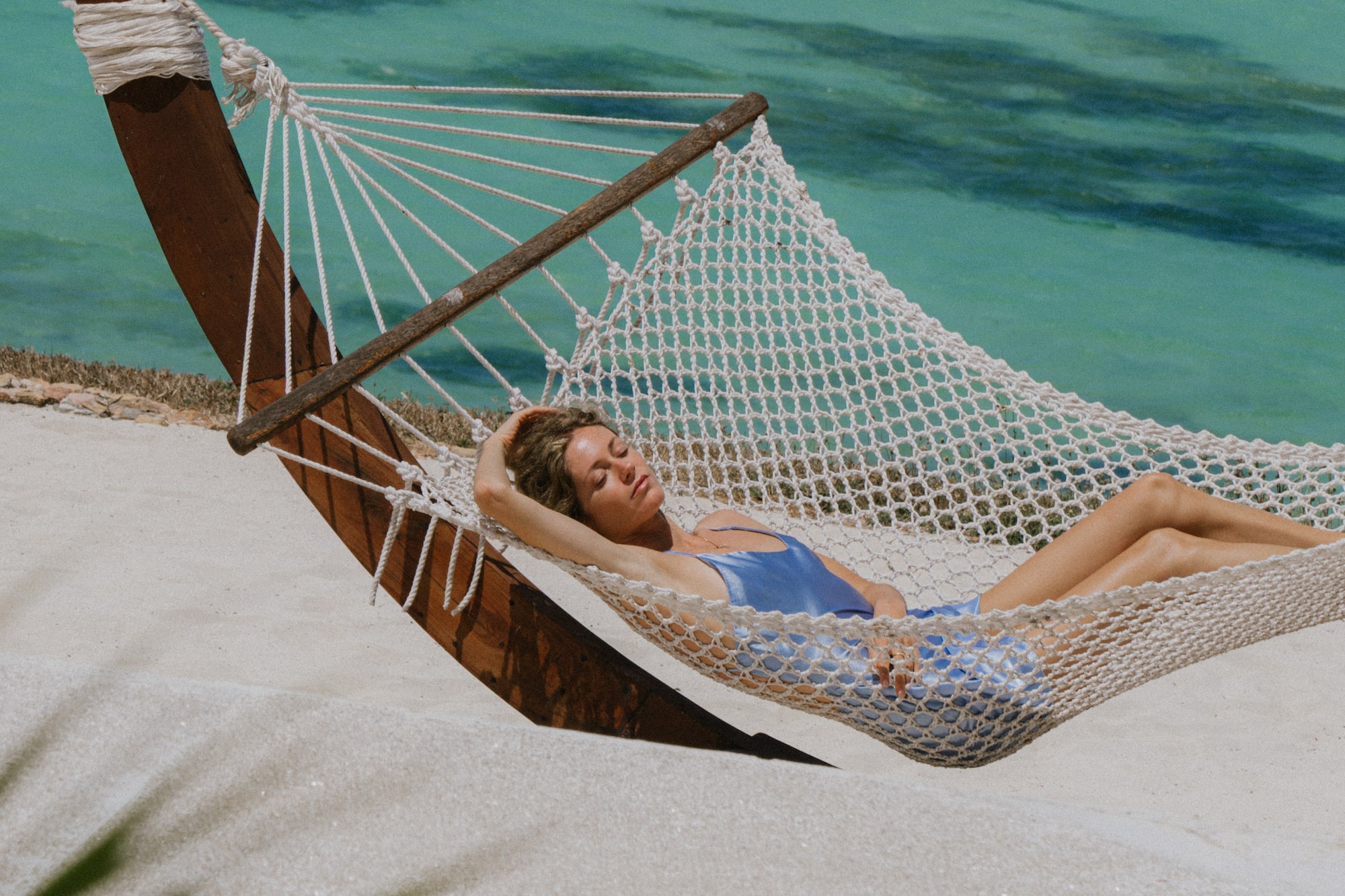 a woman lying in a hammock