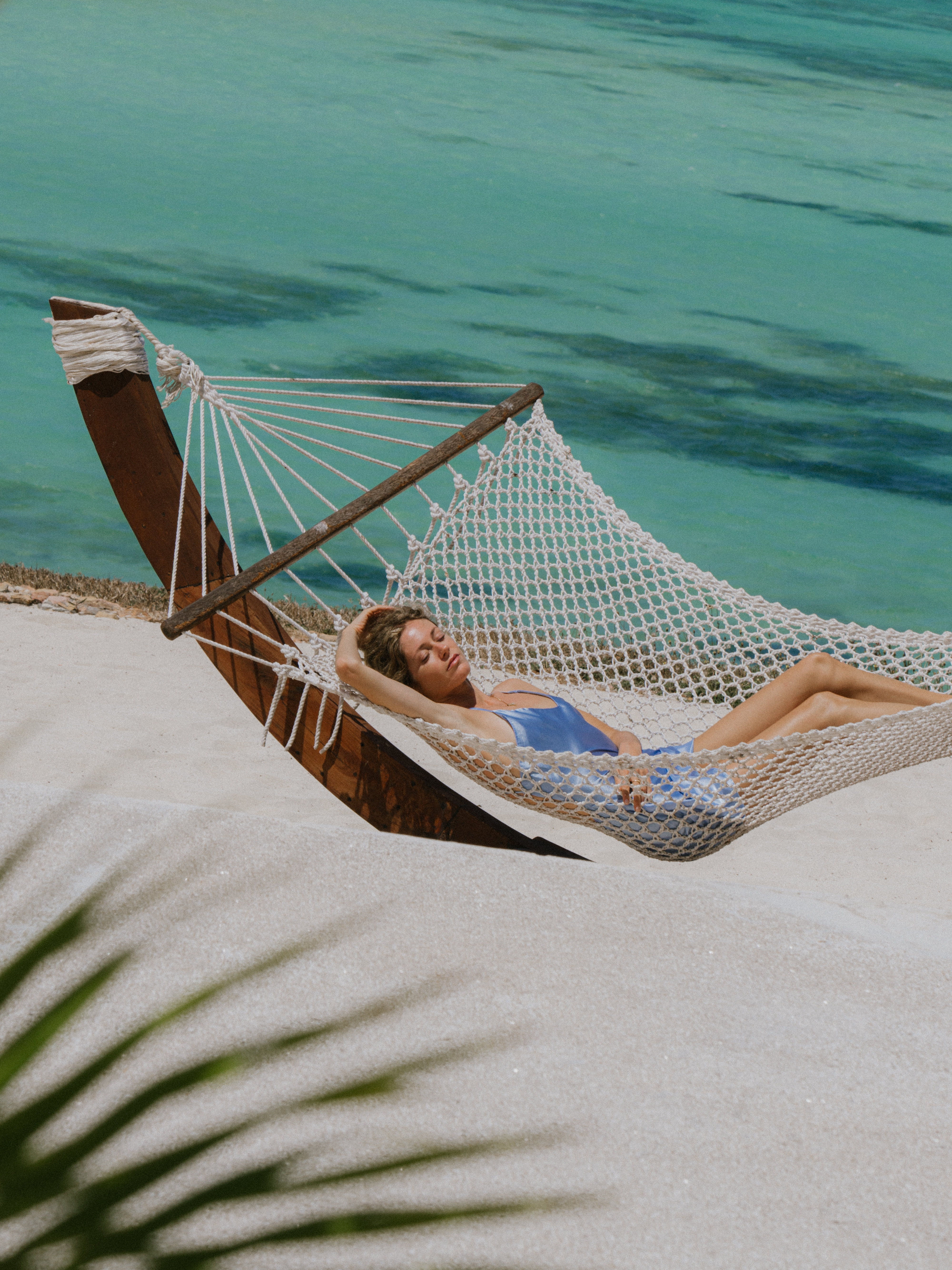 a woman lying in a hammock