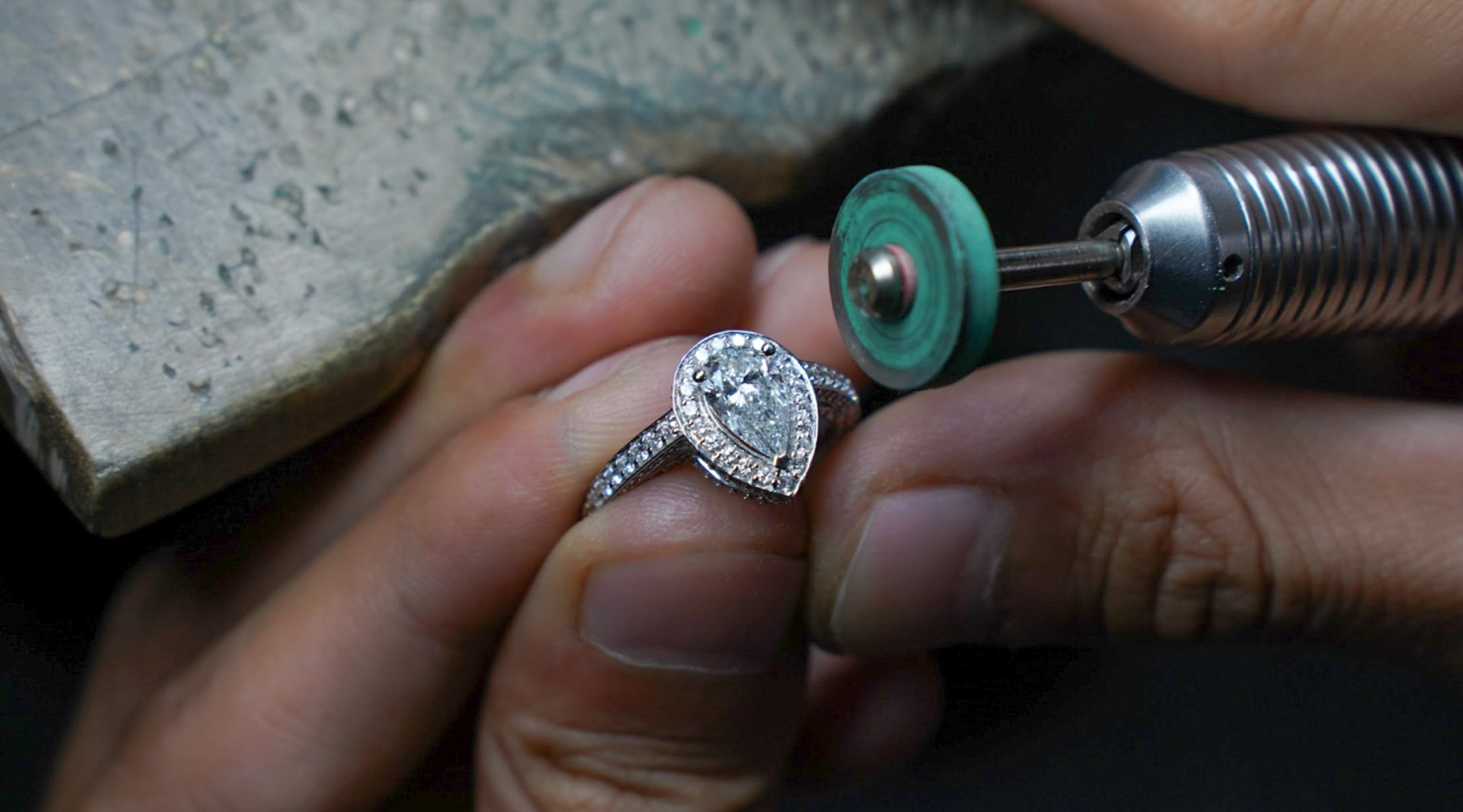 a person polishing a ring