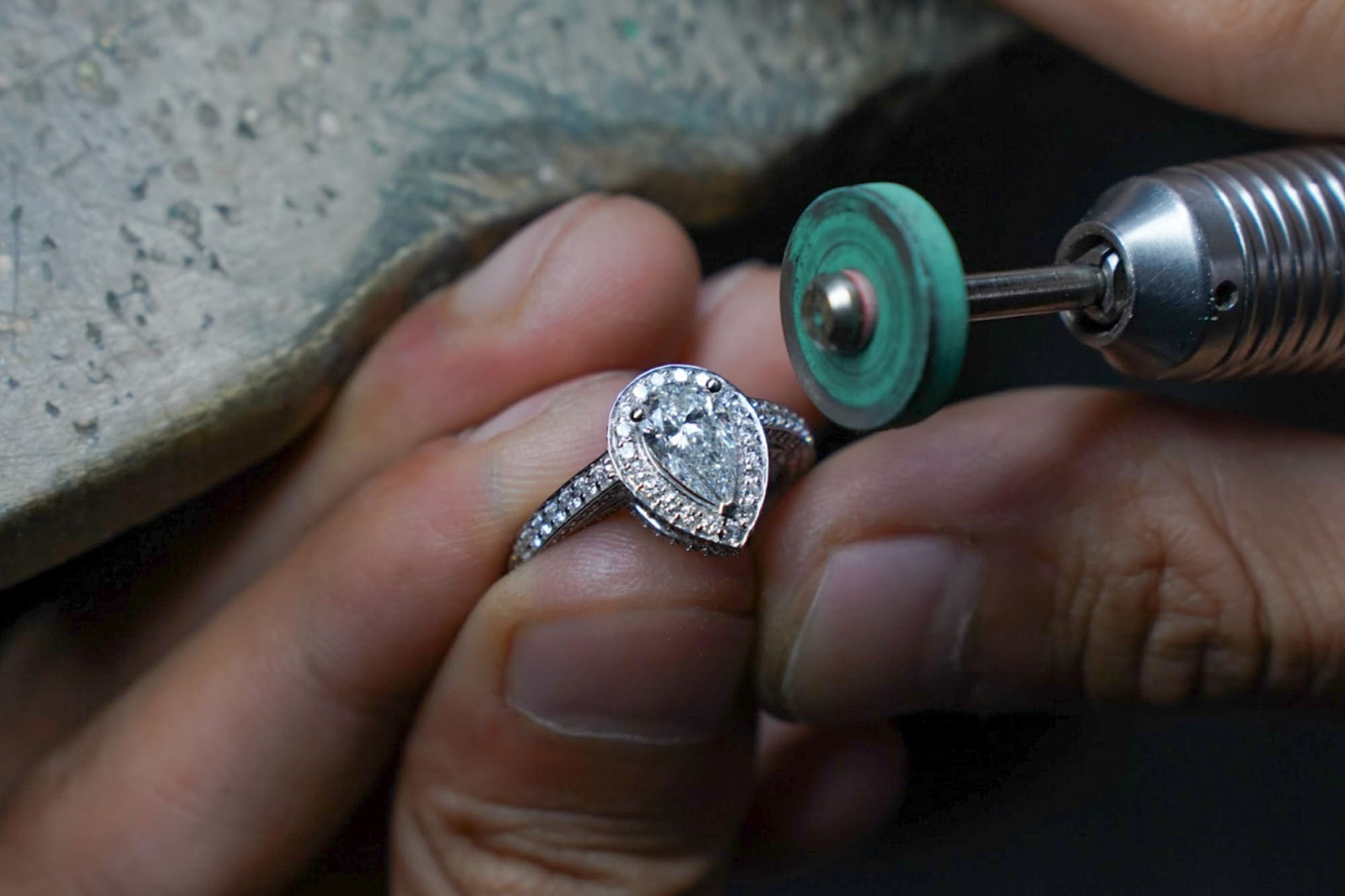 a person polishing a ring