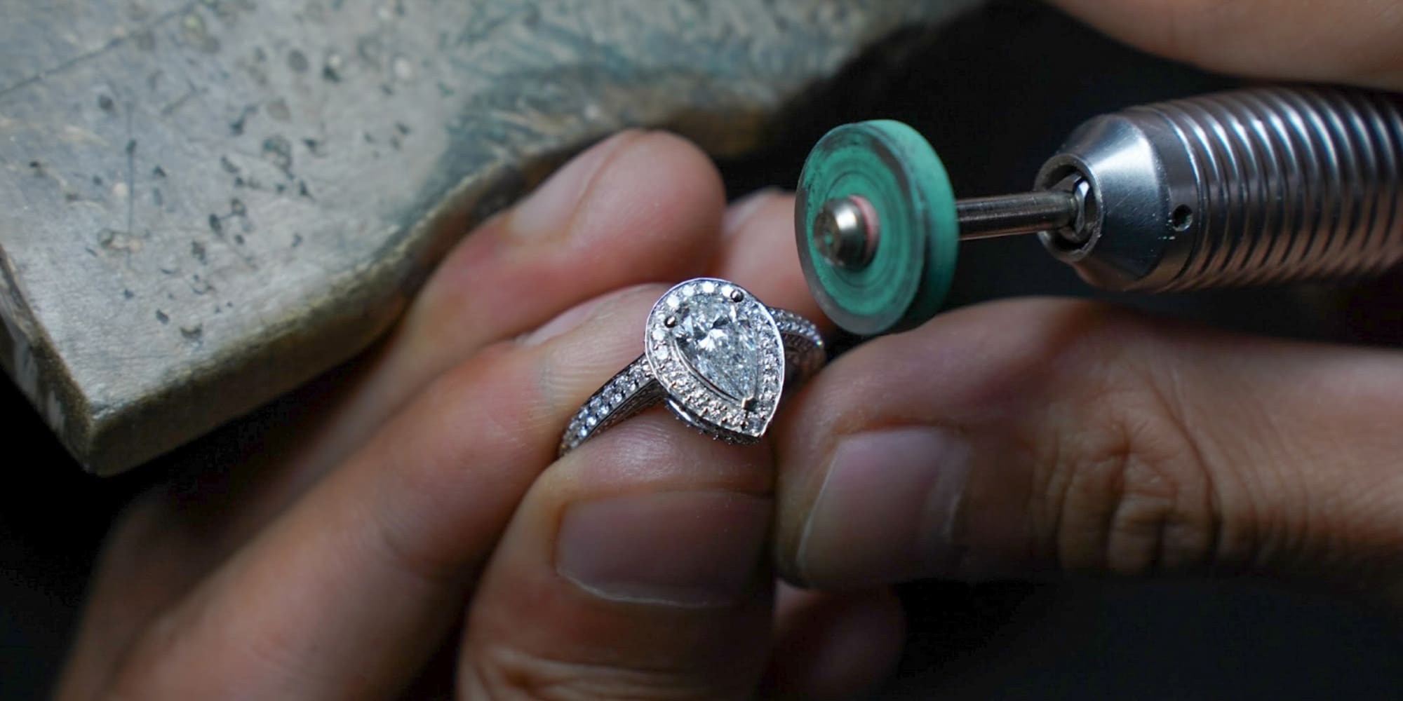 a person polishing a ring