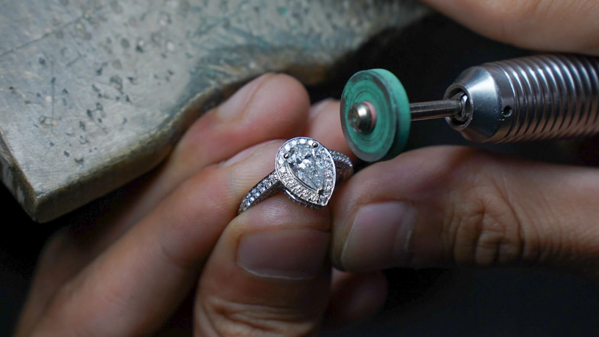 a person polishing a ring