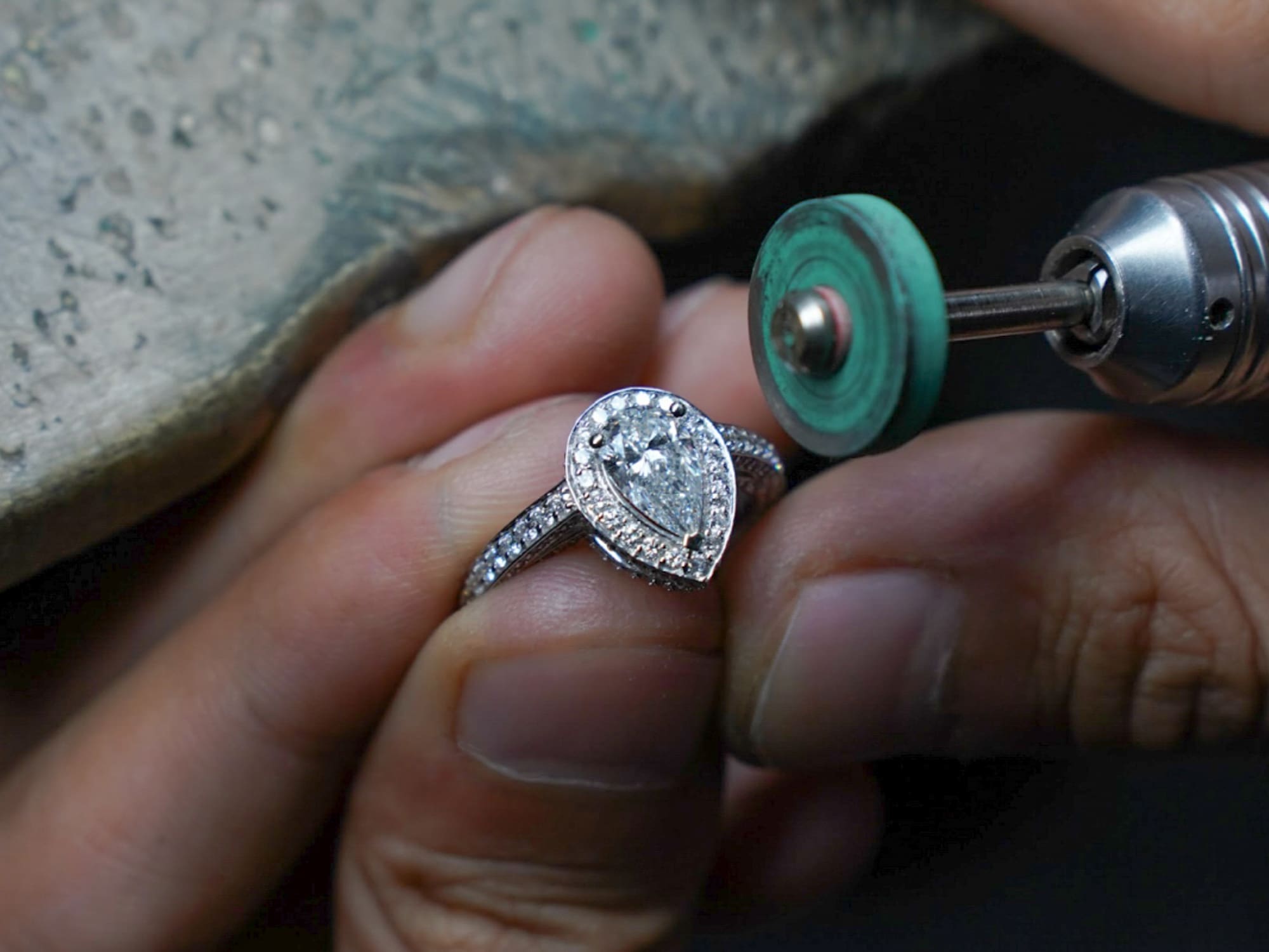 a person polishing a ring