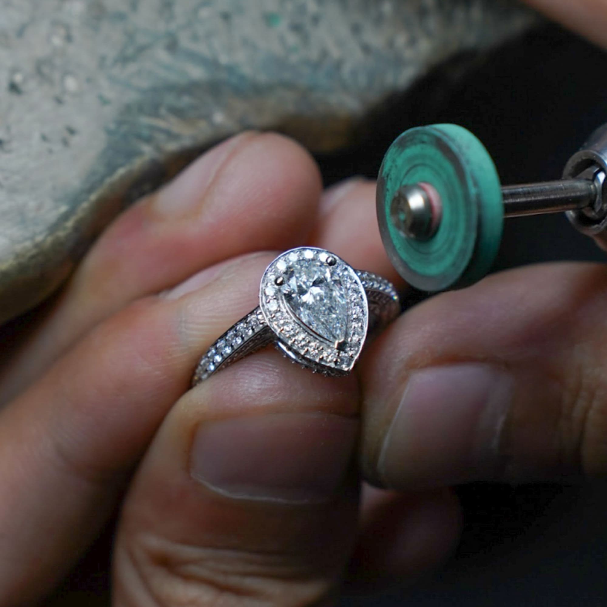 a person polishing a ring