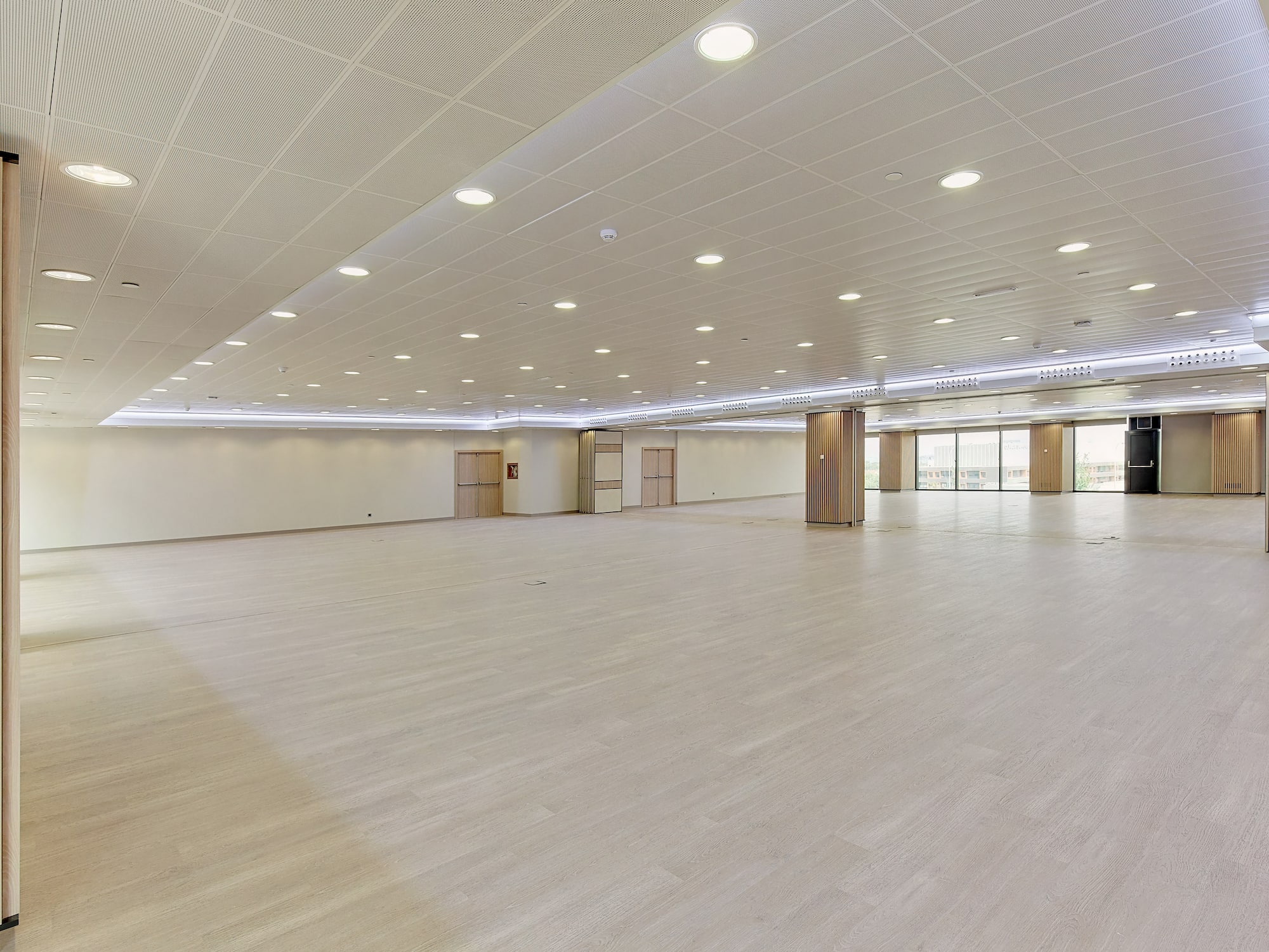 a large room with a wood floor