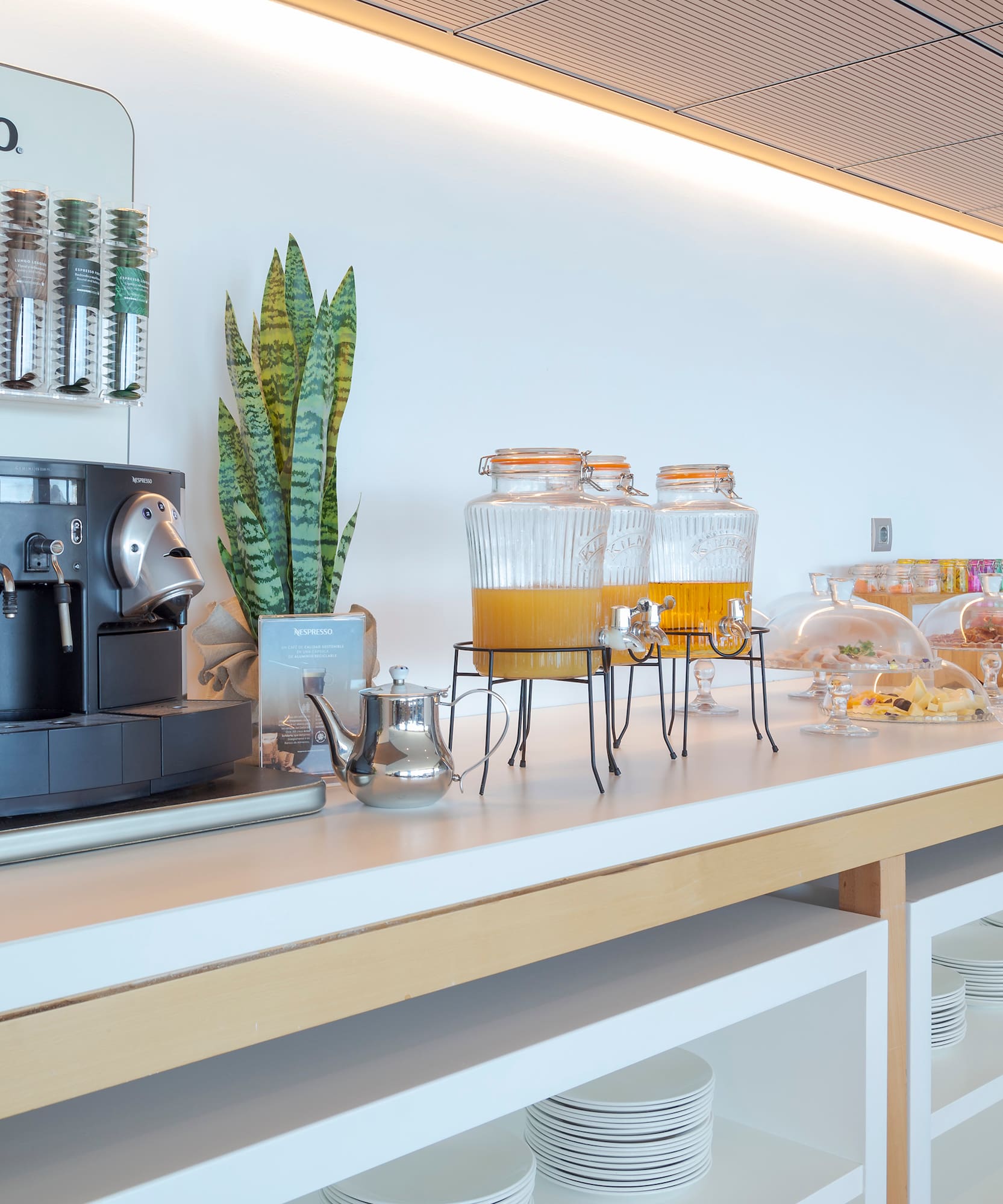 a coffee machine and drinks on a counter
