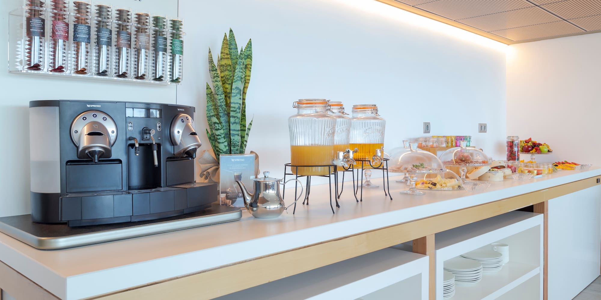 a coffee machine and drinks on a counter