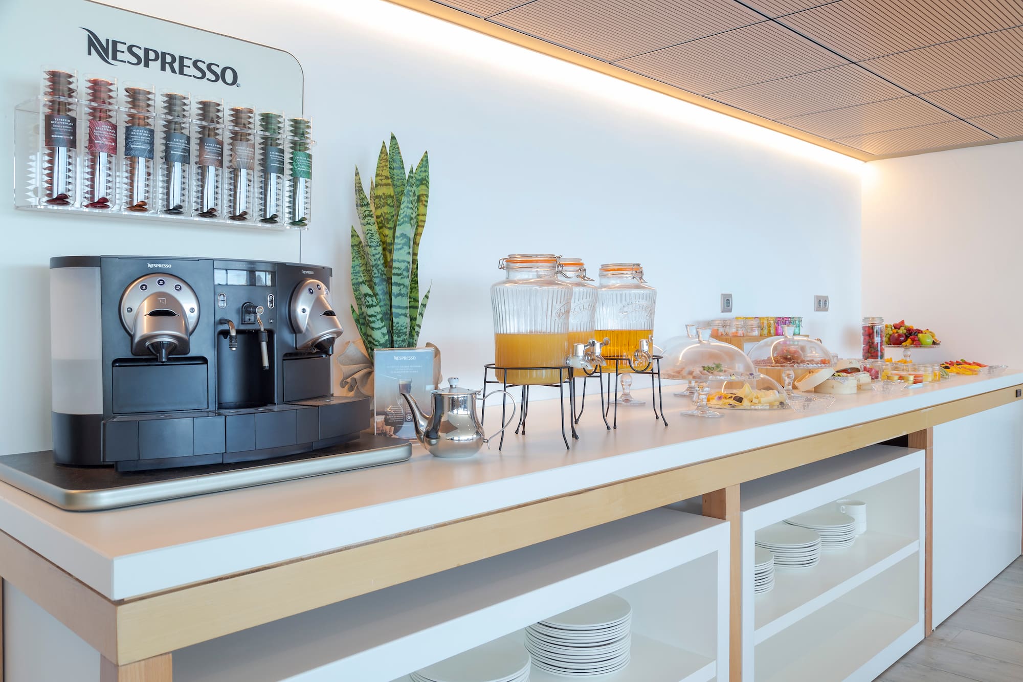 a coffee machine and drinks on a counter