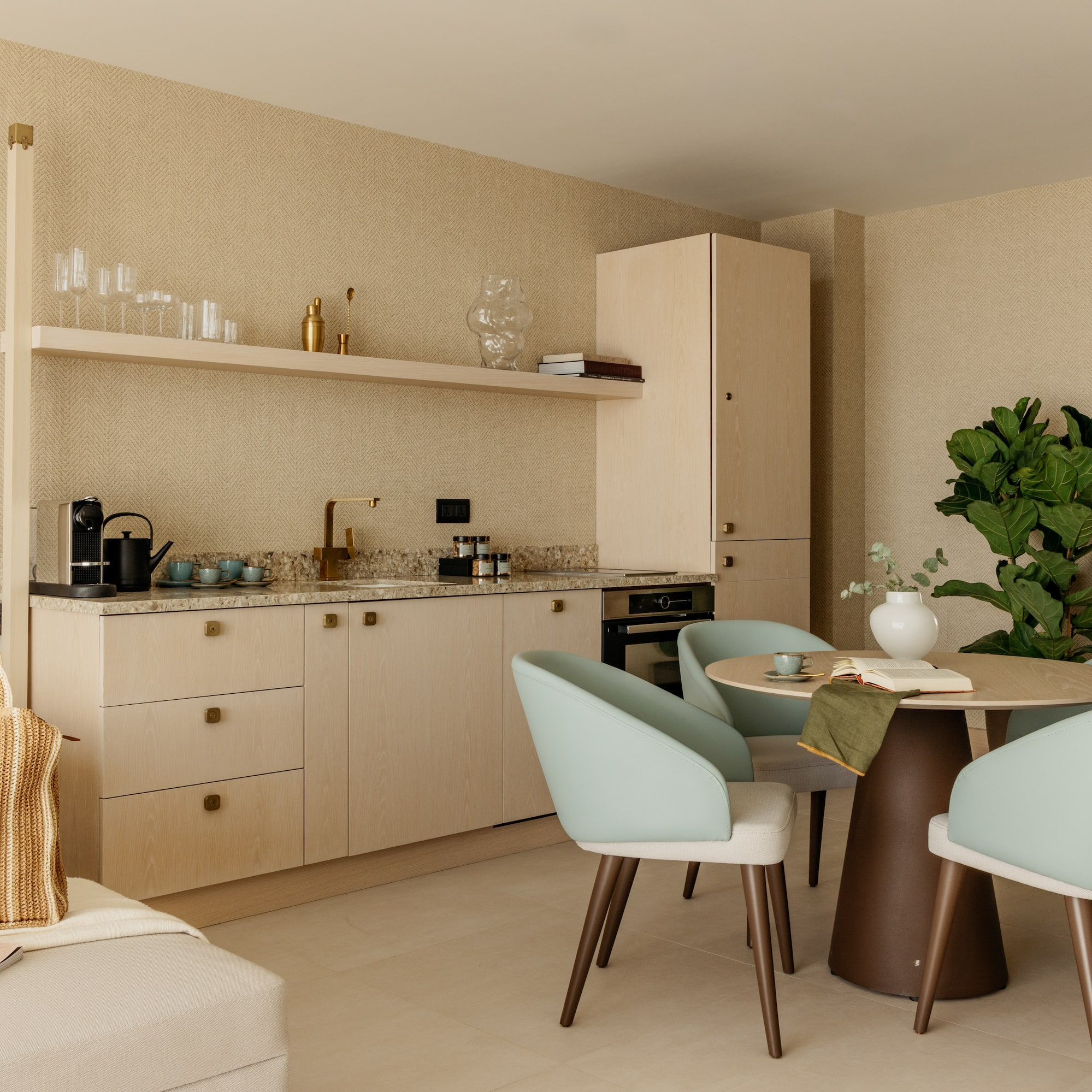 a kitchen with a table and chairs