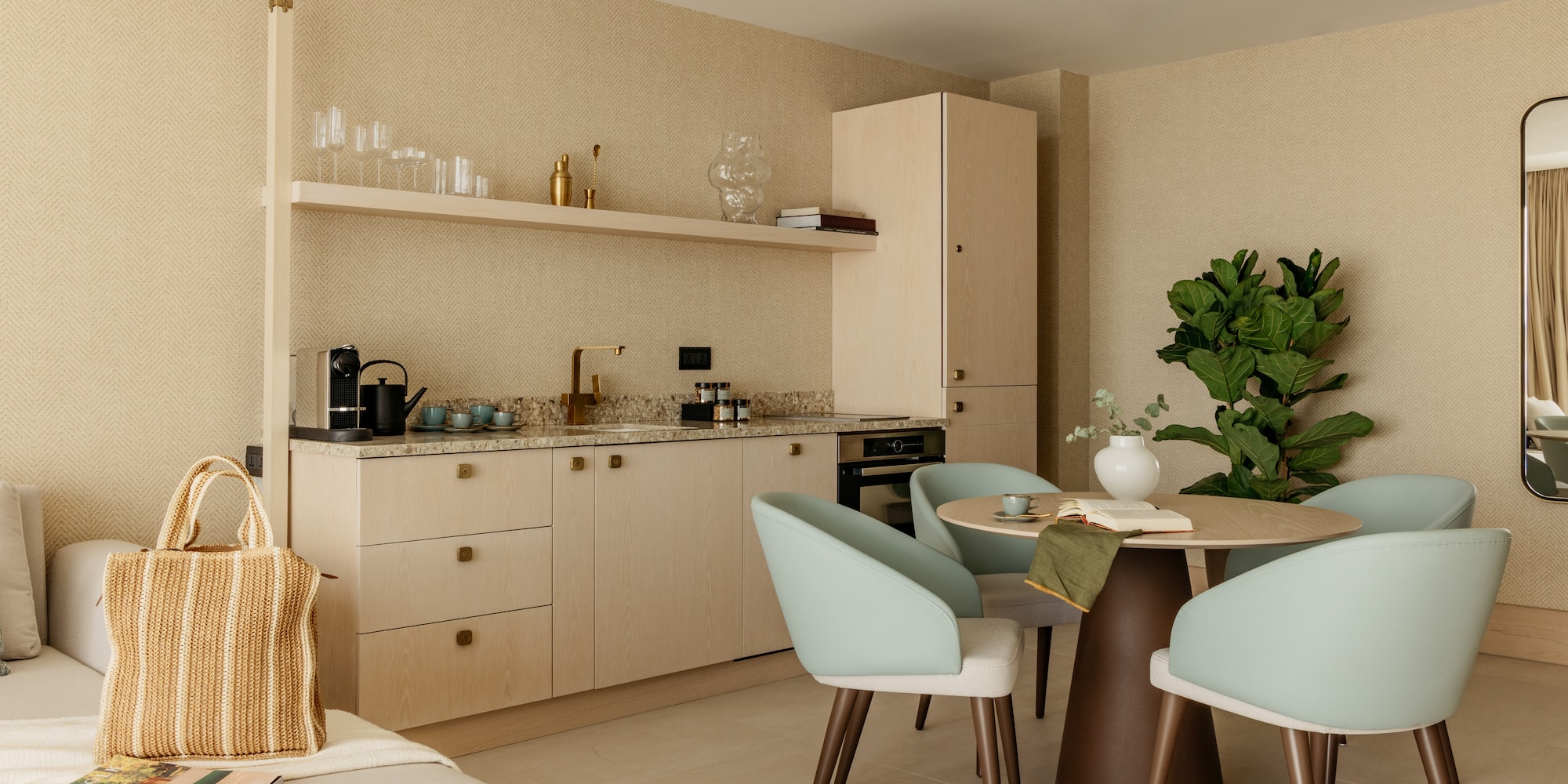 a kitchen with a table and chairs