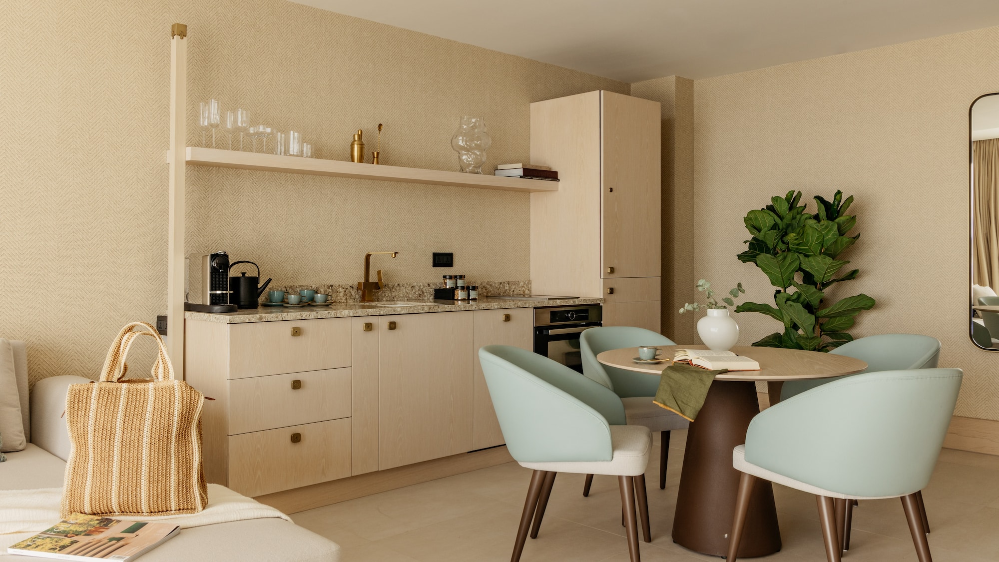 a kitchen with a table and chairs