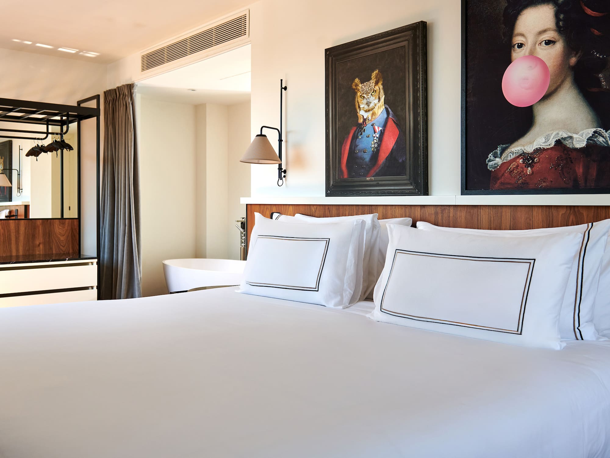 a bed with pillows and a painting of a tiger