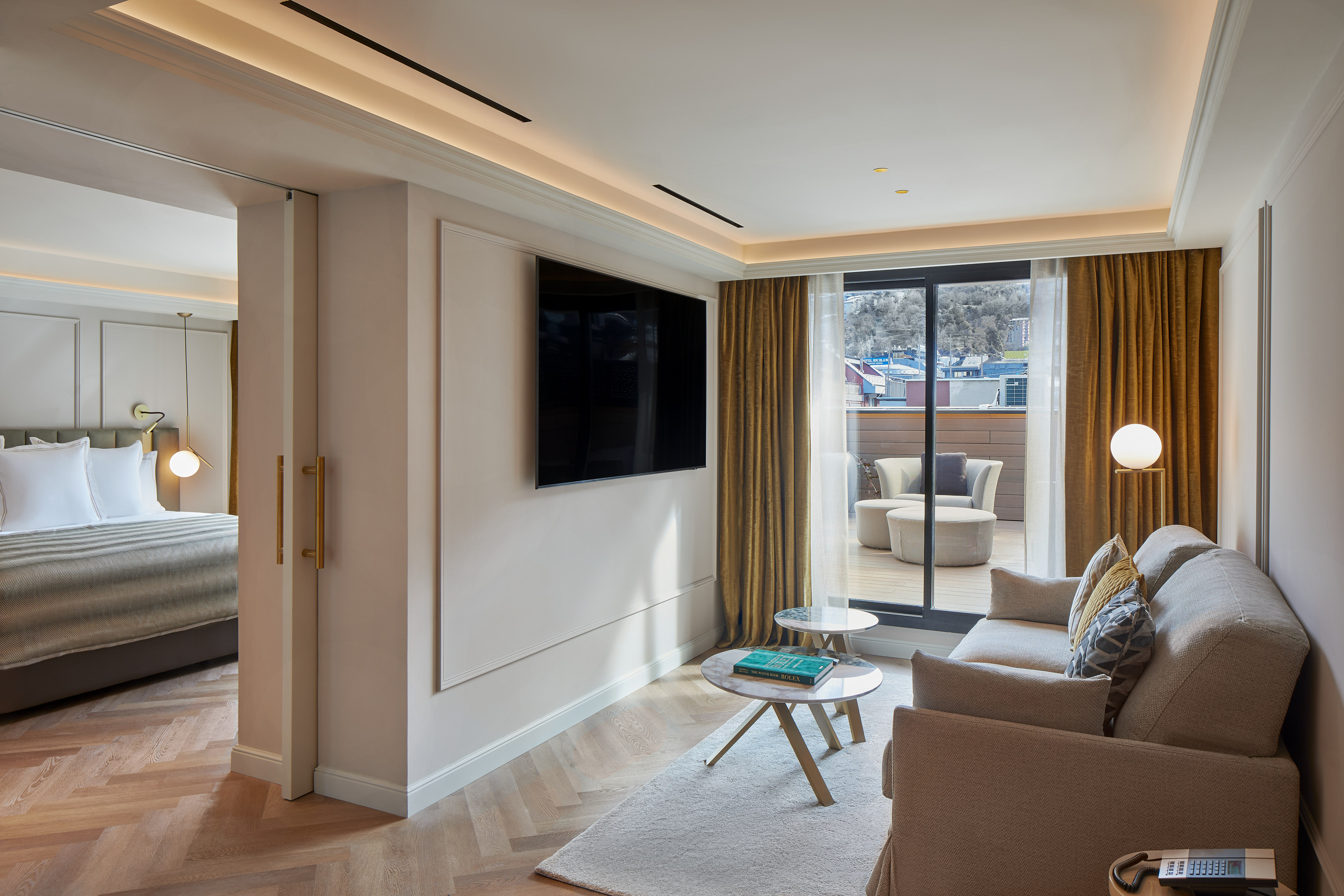 a living room with a tv on the wall