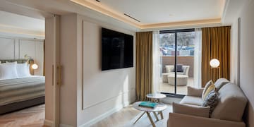 a living room with a tv on the wall