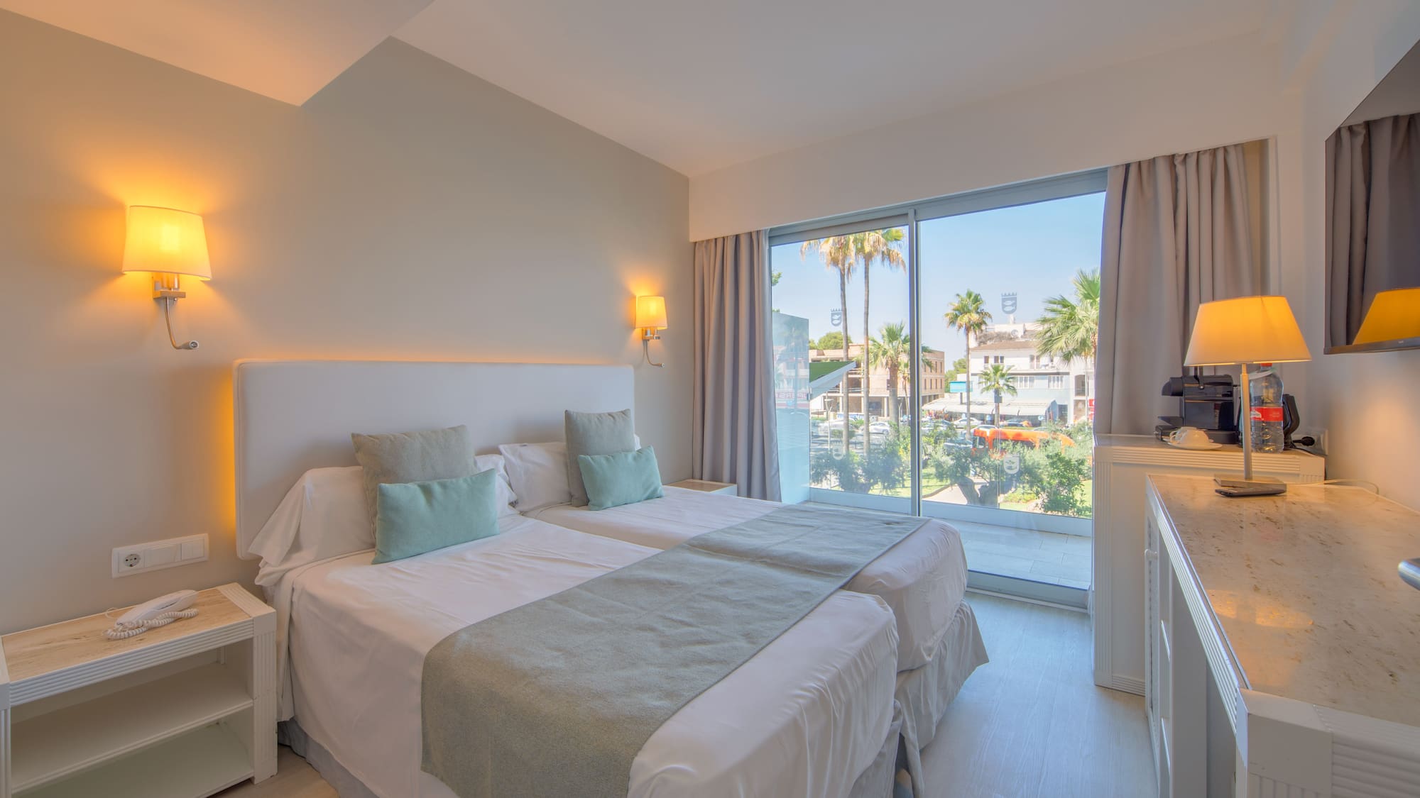 a bedroom with a double bed and a window