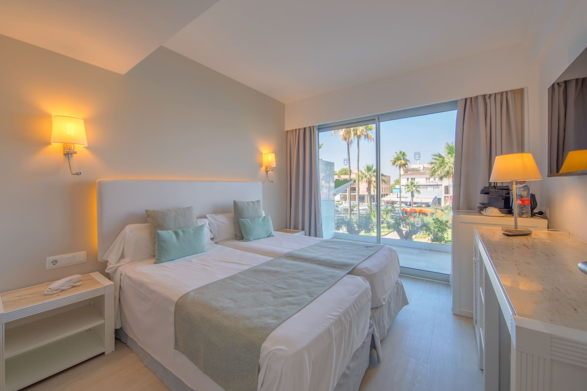 a bedroom with a double bed and a window