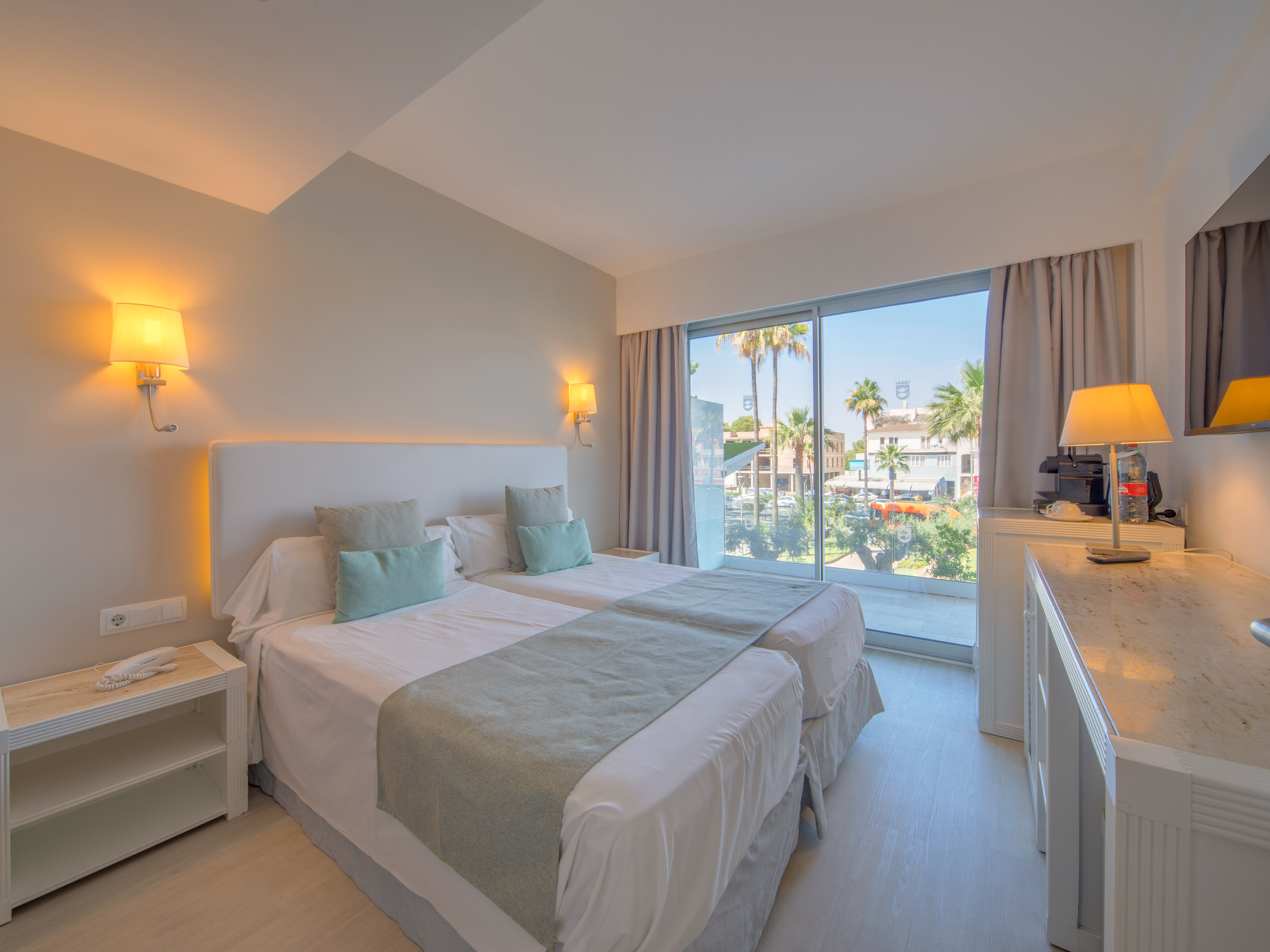 a bedroom with a double bed and a window