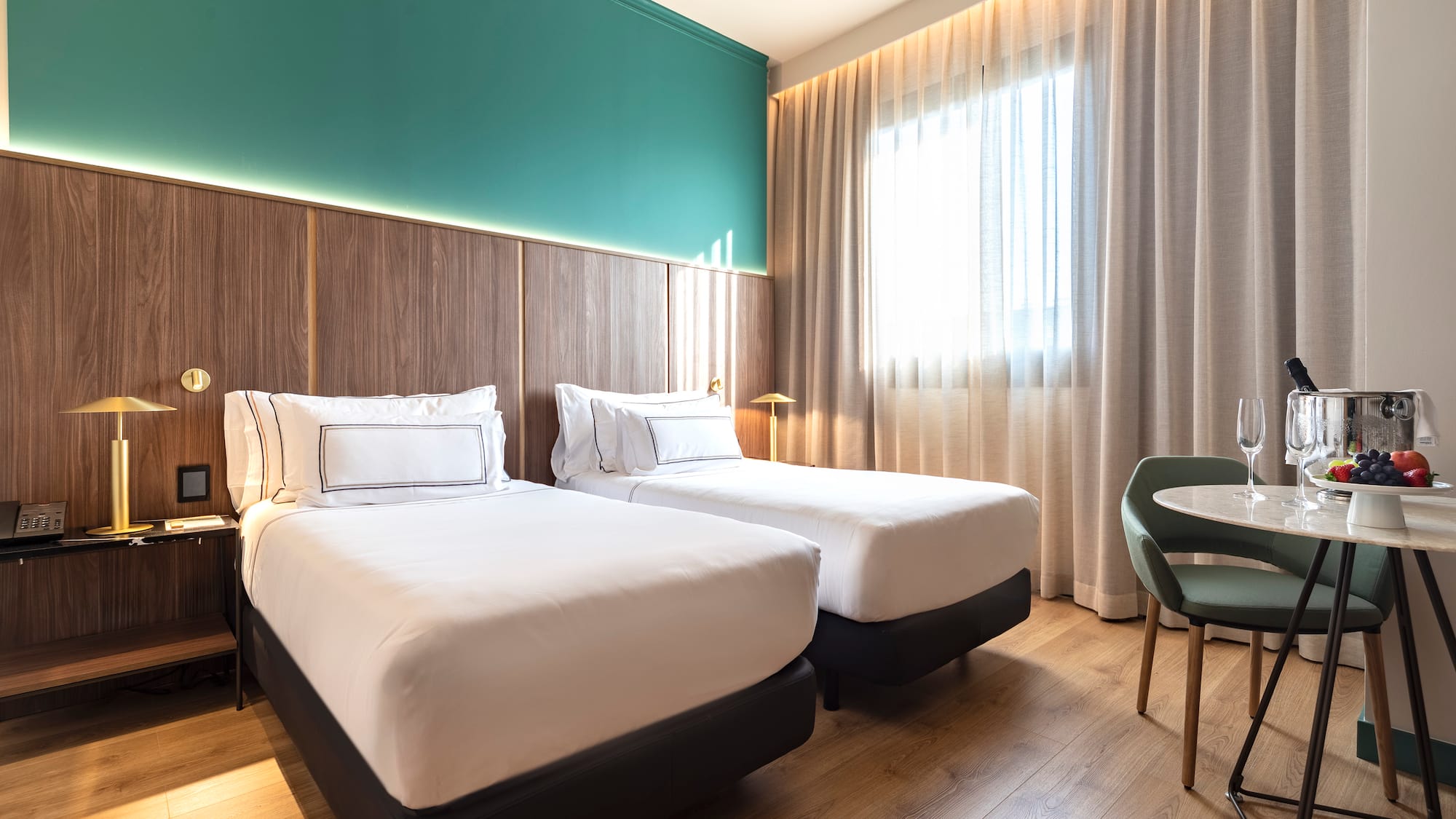 a room with two beds and a table