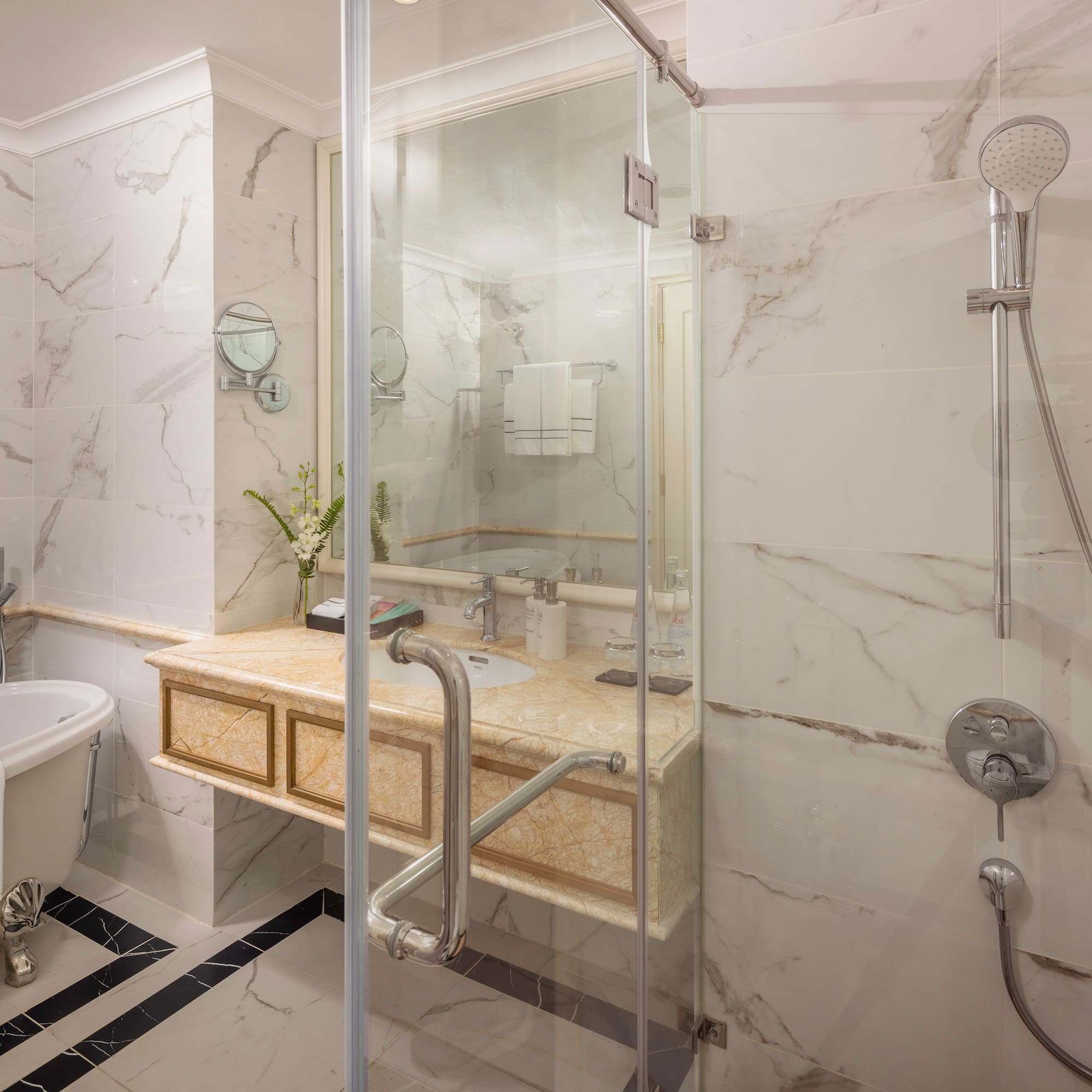 a bathroom with a shower and sink