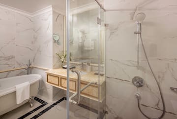 a bathroom with a shower and sink