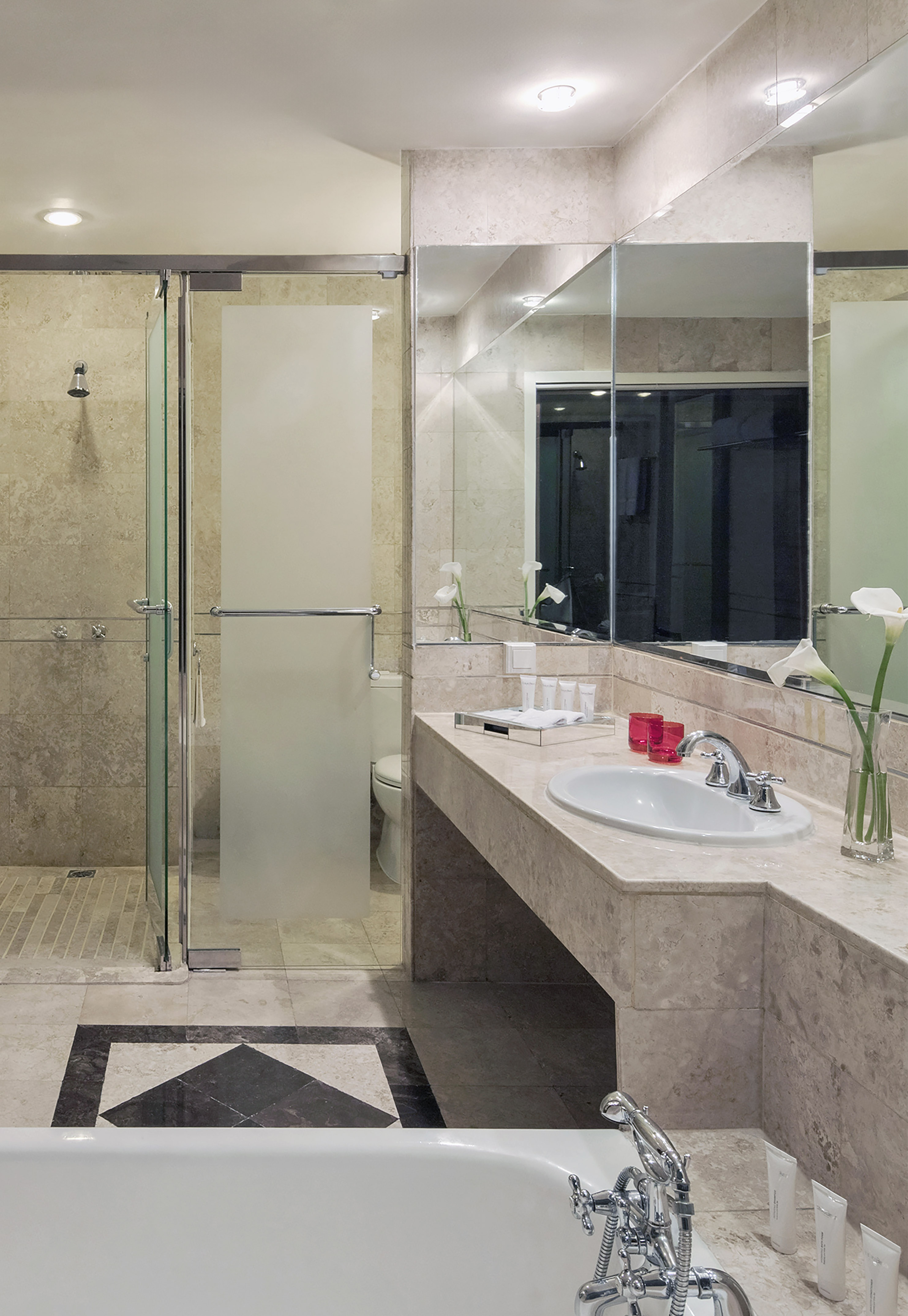 a bathroom with a shower and sink