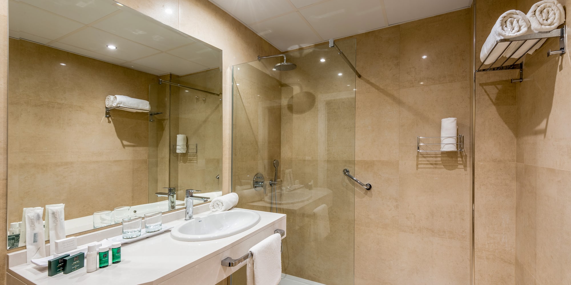 a bathroom with a shower and sink