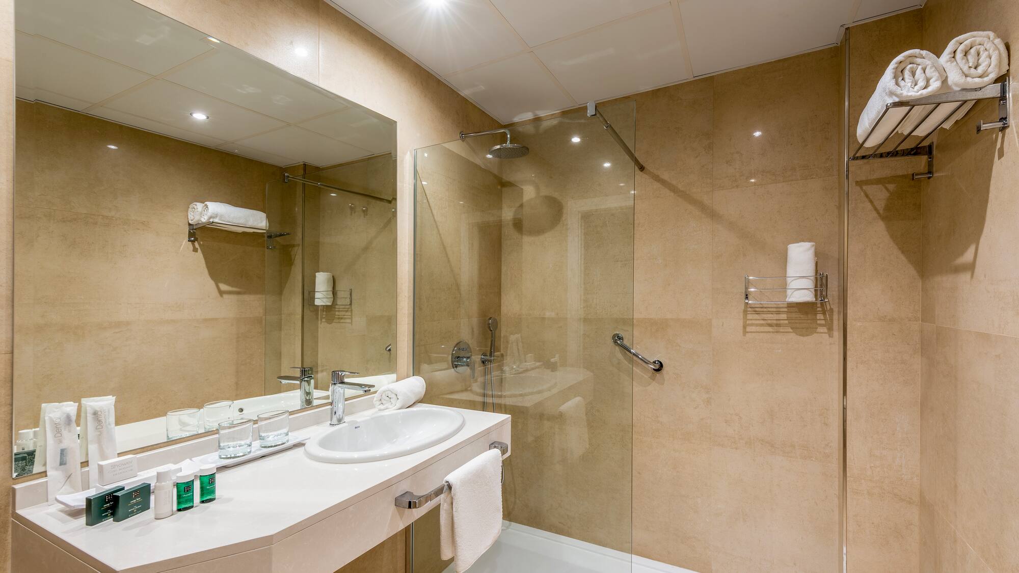 a bathroom with a shower and sink