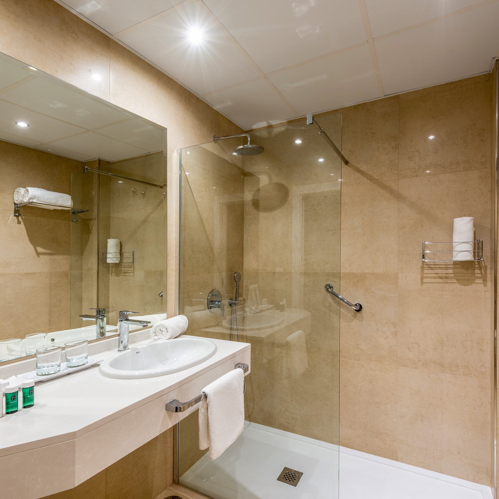 a bathroom with a shower and sink