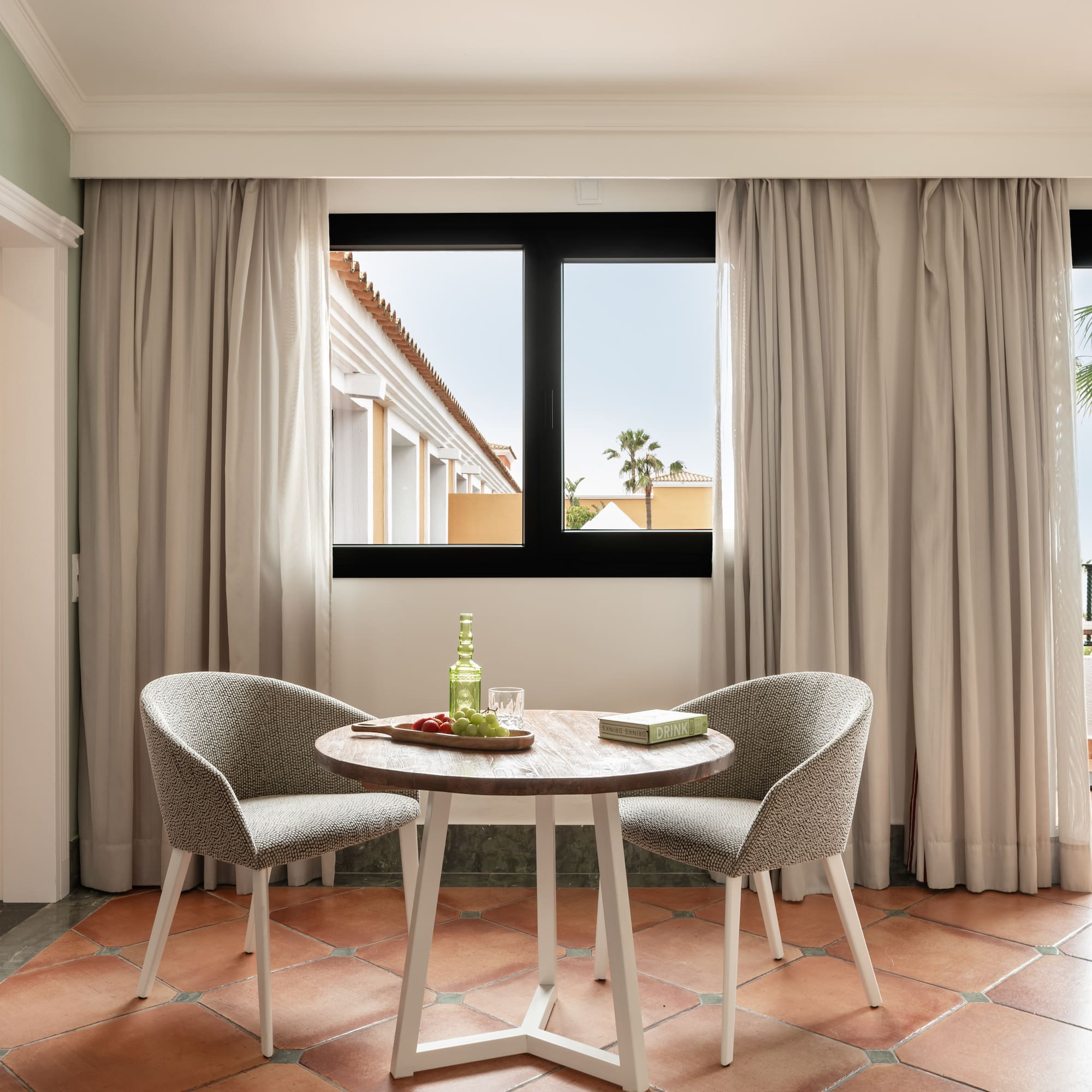 a room with a table and chairs