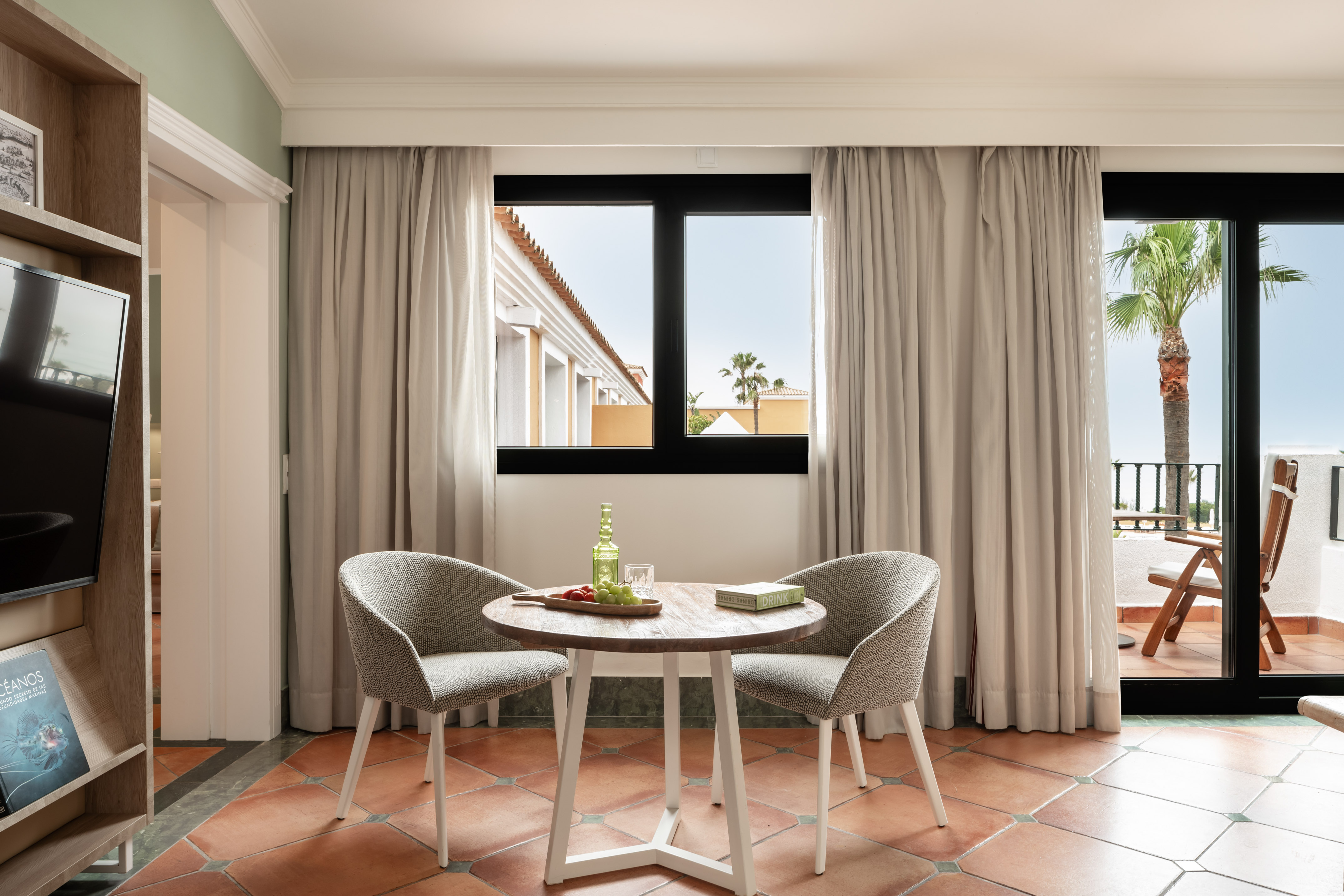 a room with a table and chairs