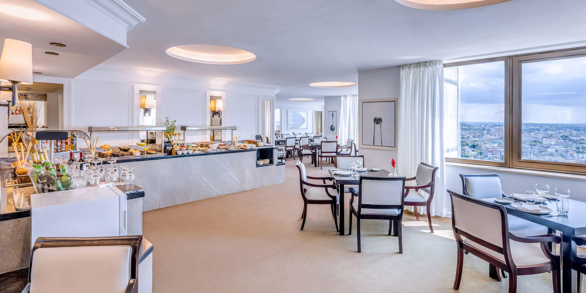 a room with a buffet and tables