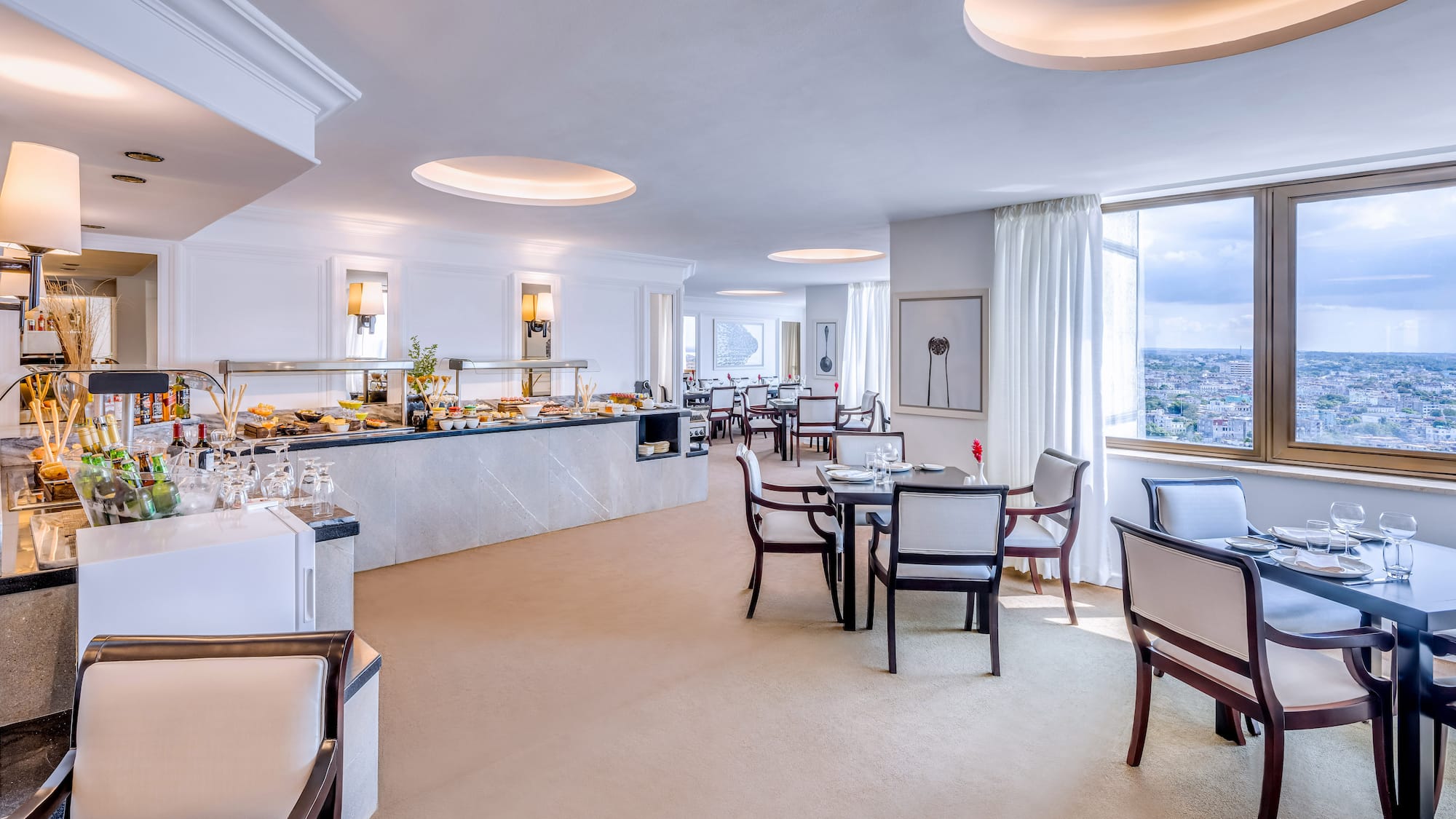 a room with a buffet and tables