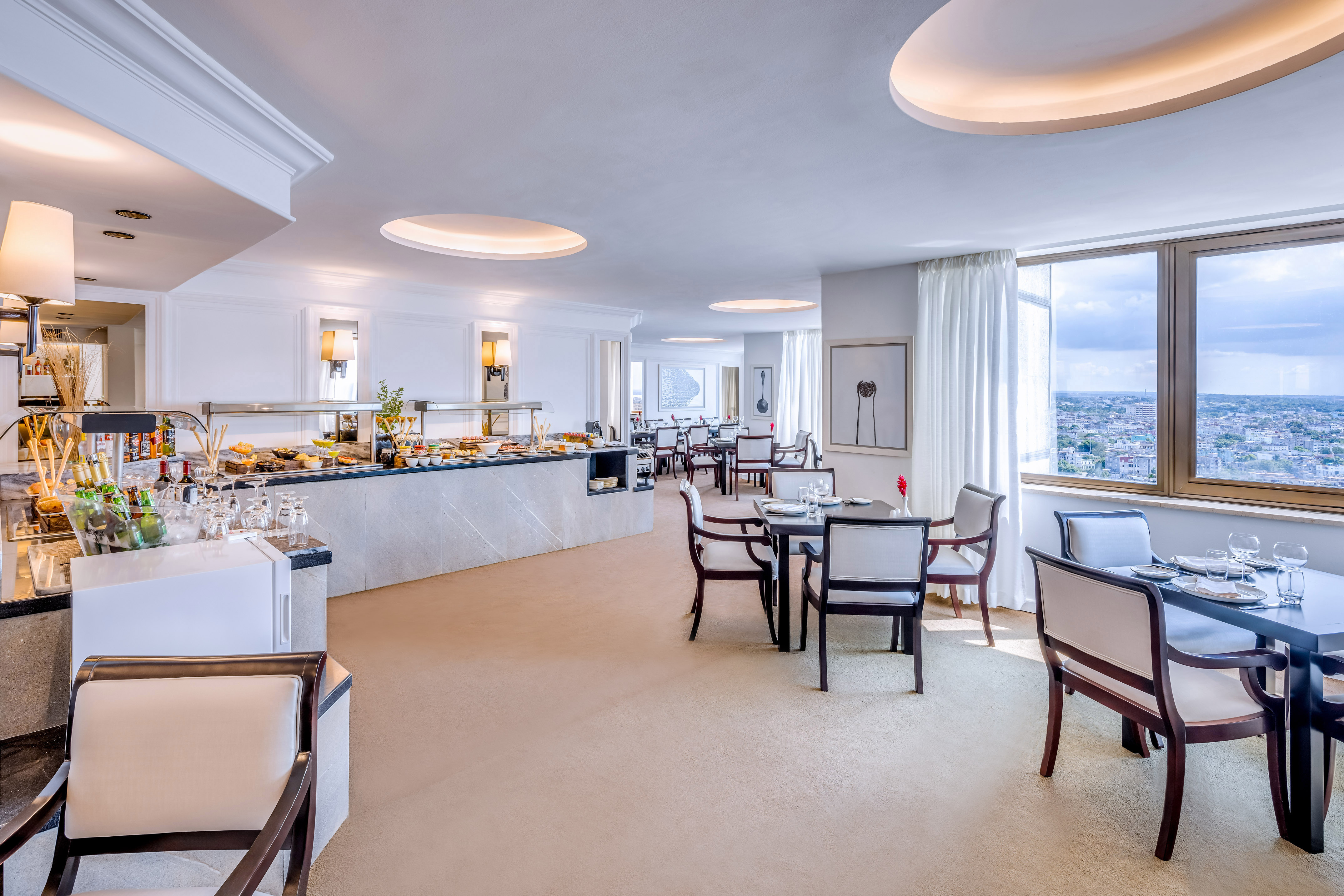 a room with a buffet and tables