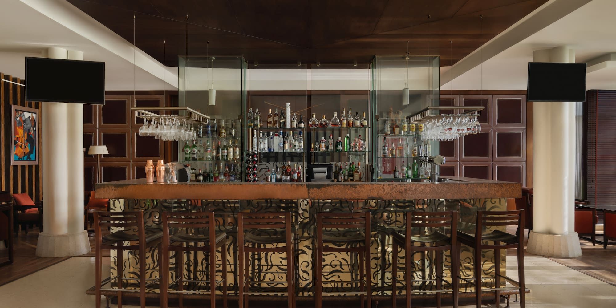 a bar with a bar and chairs