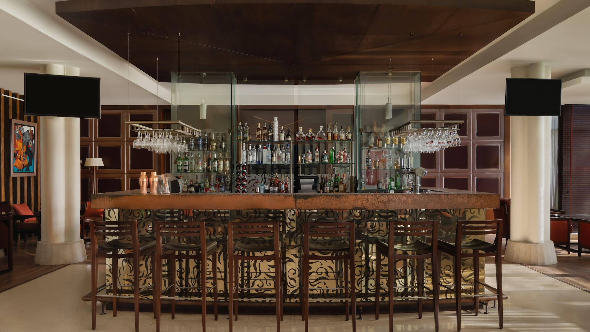 a bar with a bar and chairs