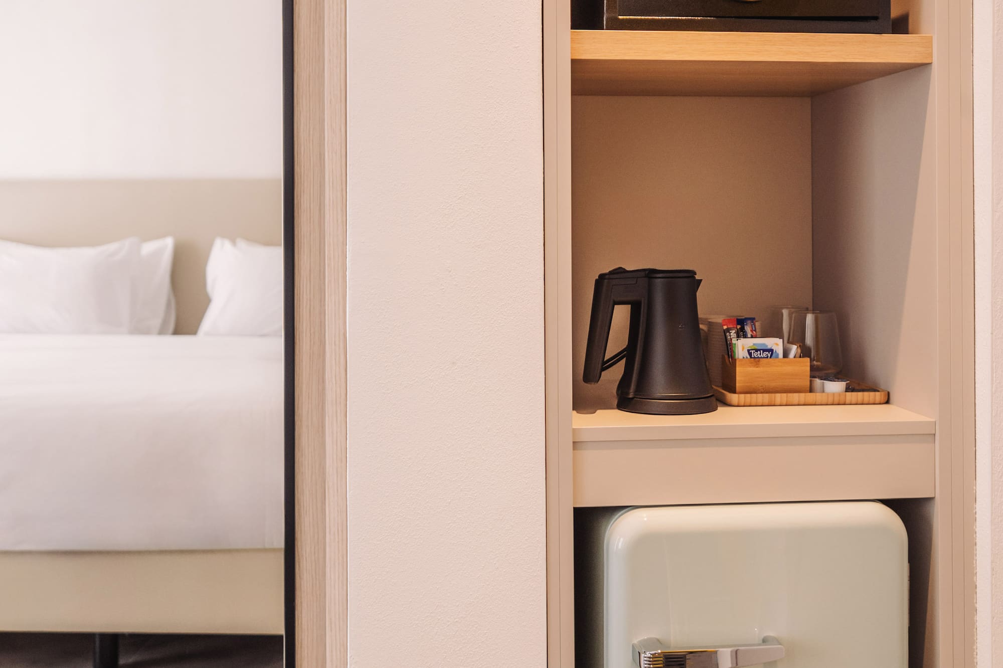 a small refrigerator in a shelf