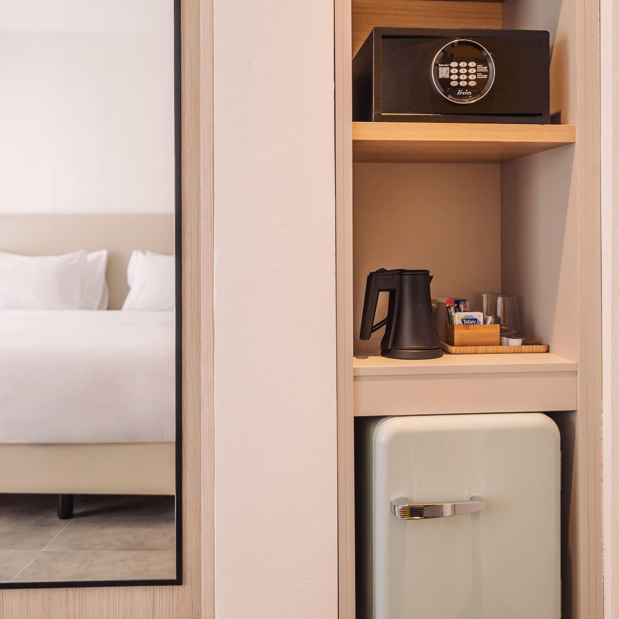 a small refrigerator in a shelf