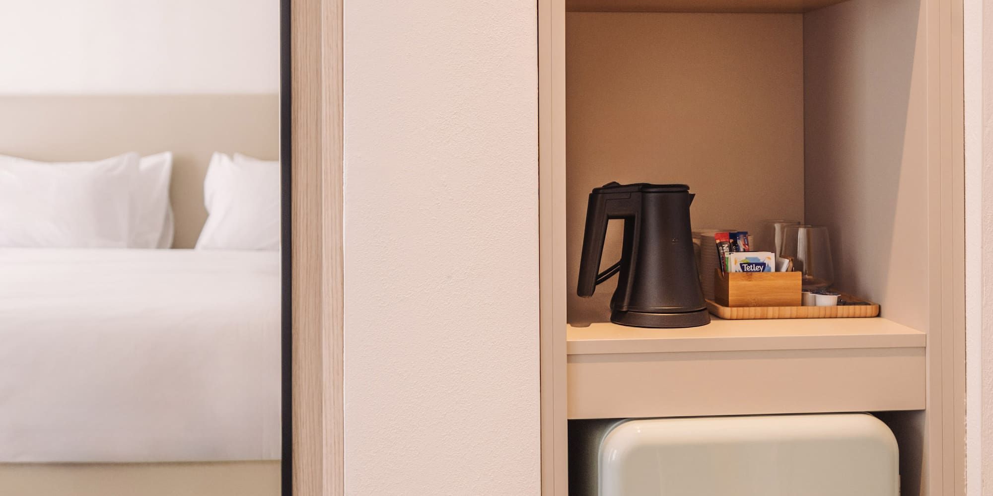 a small refrigerator in a shelf