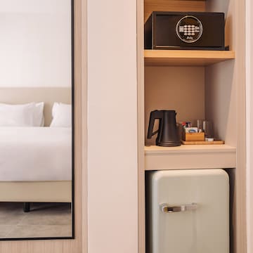 a small refrigerator in a shelf