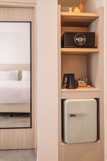 a small refrigerator in a shelf