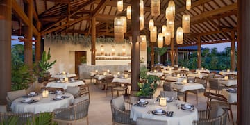 a restaurant with tables and chairs