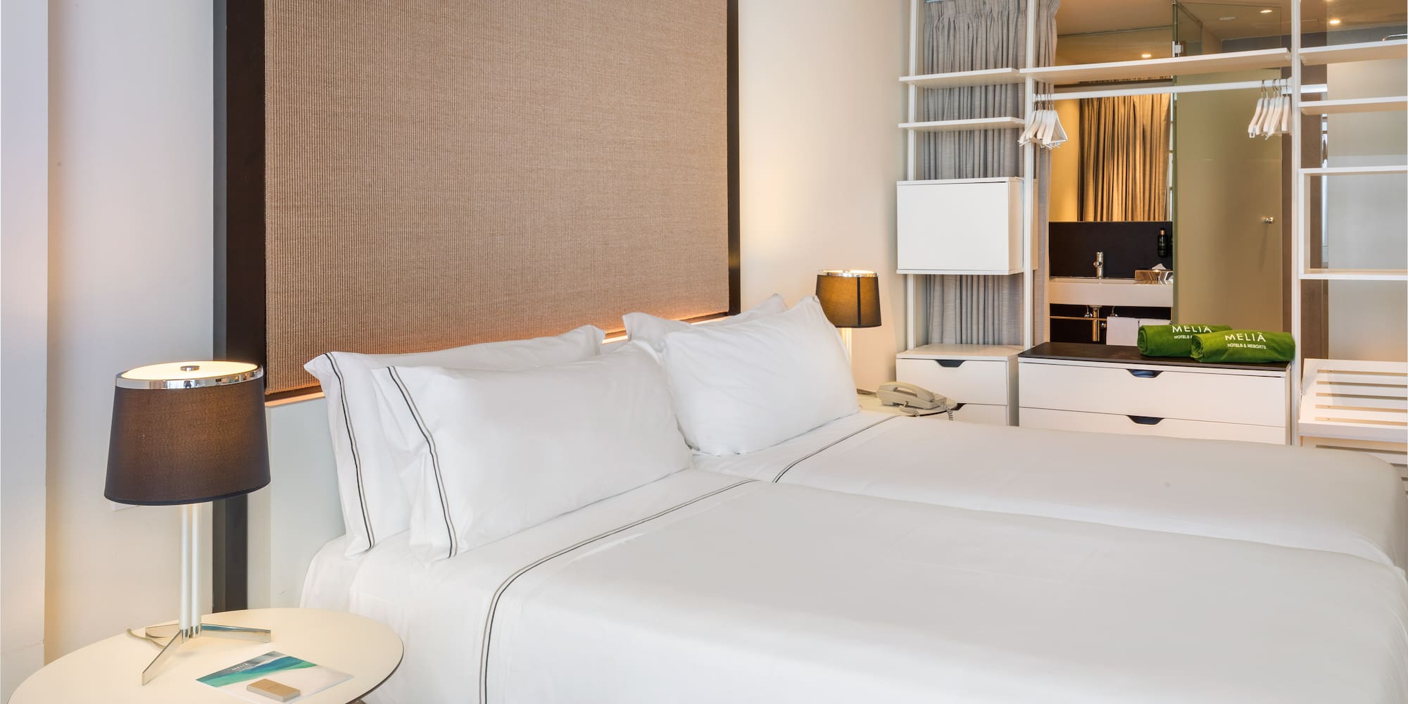 a hotel room with two beds