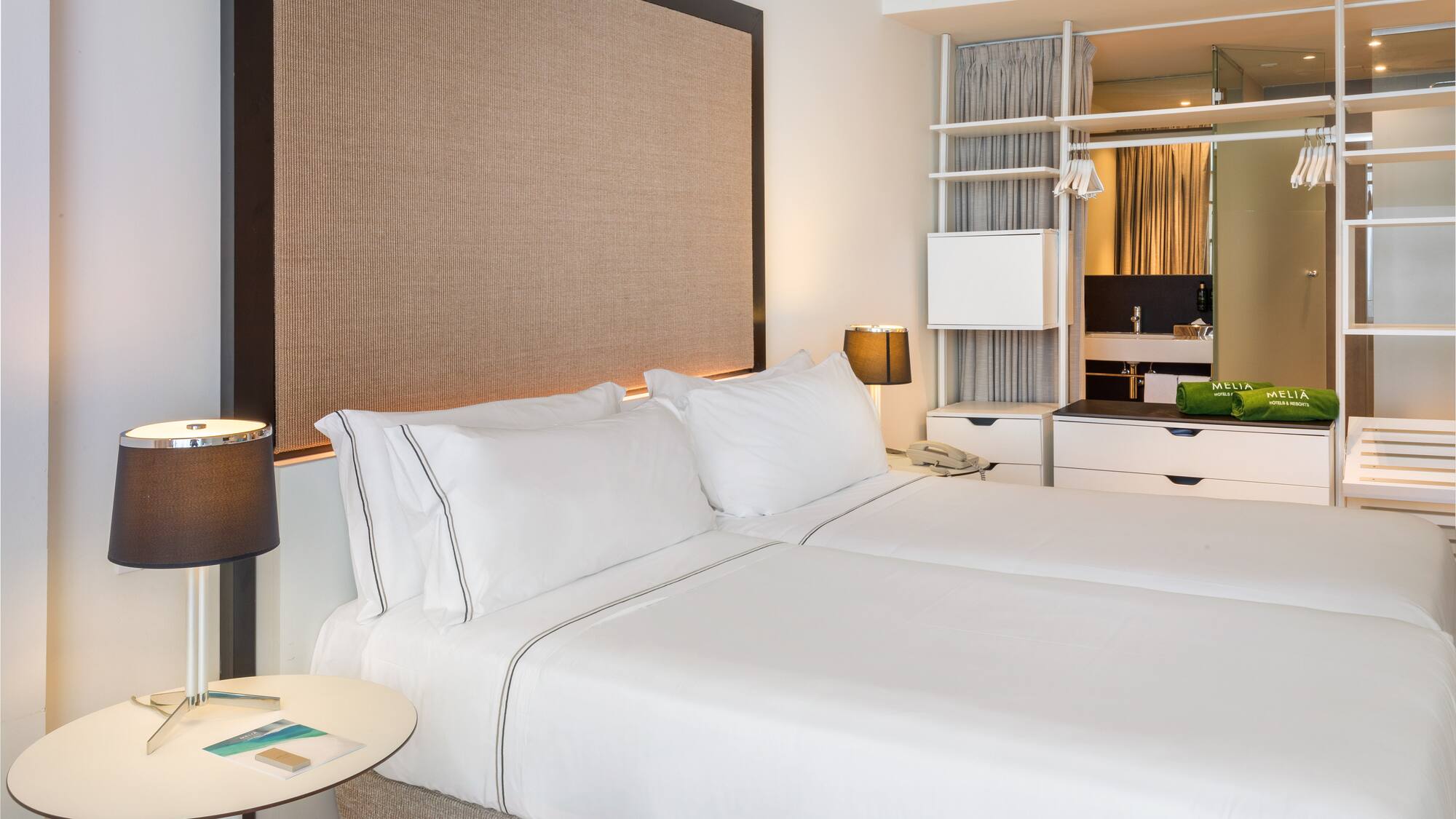 a hotel room with two beds